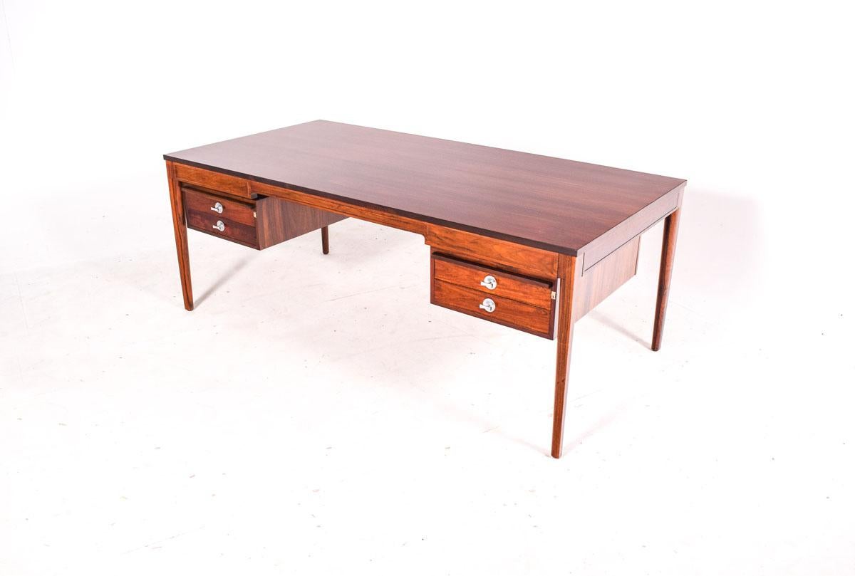 Mid century rosewood desk designed by Finn Juhl in the 1960´s, produced by Cado, in Denmark. High quality design and craftsmanship. Vivid rosewood veneer.