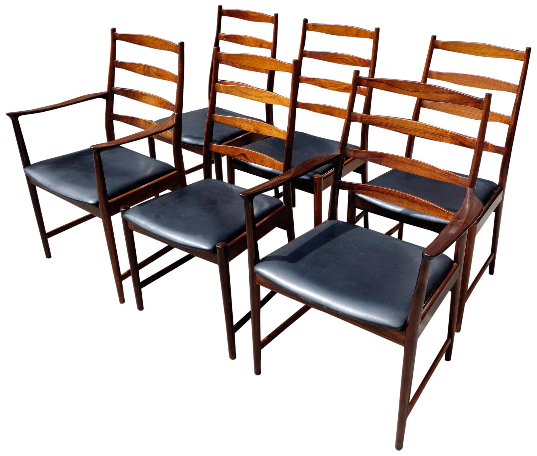 Wonderful set of 6 (six) rosewood dining chairs featuring two armchairs and 4 (four) side chairs. Very comfortable and of high quality. Vamo Sonderbor of Denmark employed designers such as Johannes Andersen, Arne Vodder, and Torbjorn Afdal.