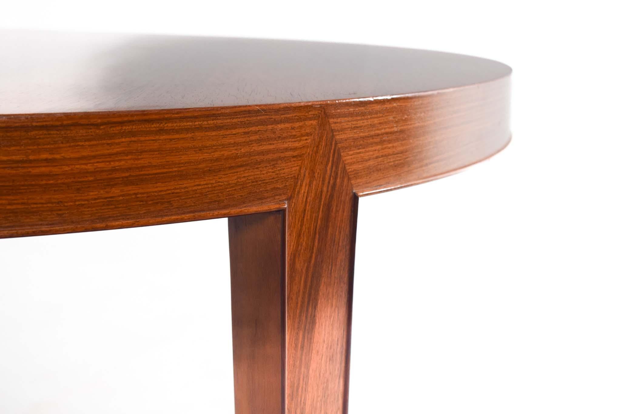 This exquisite rosewood dining table is a timeless piece of Danish design, featuring Severin Hansen's signature angled joinery. Its beautifully crafted tabletop showcases a rich rosewood grain with a sleek framing detail along the legs and bottom