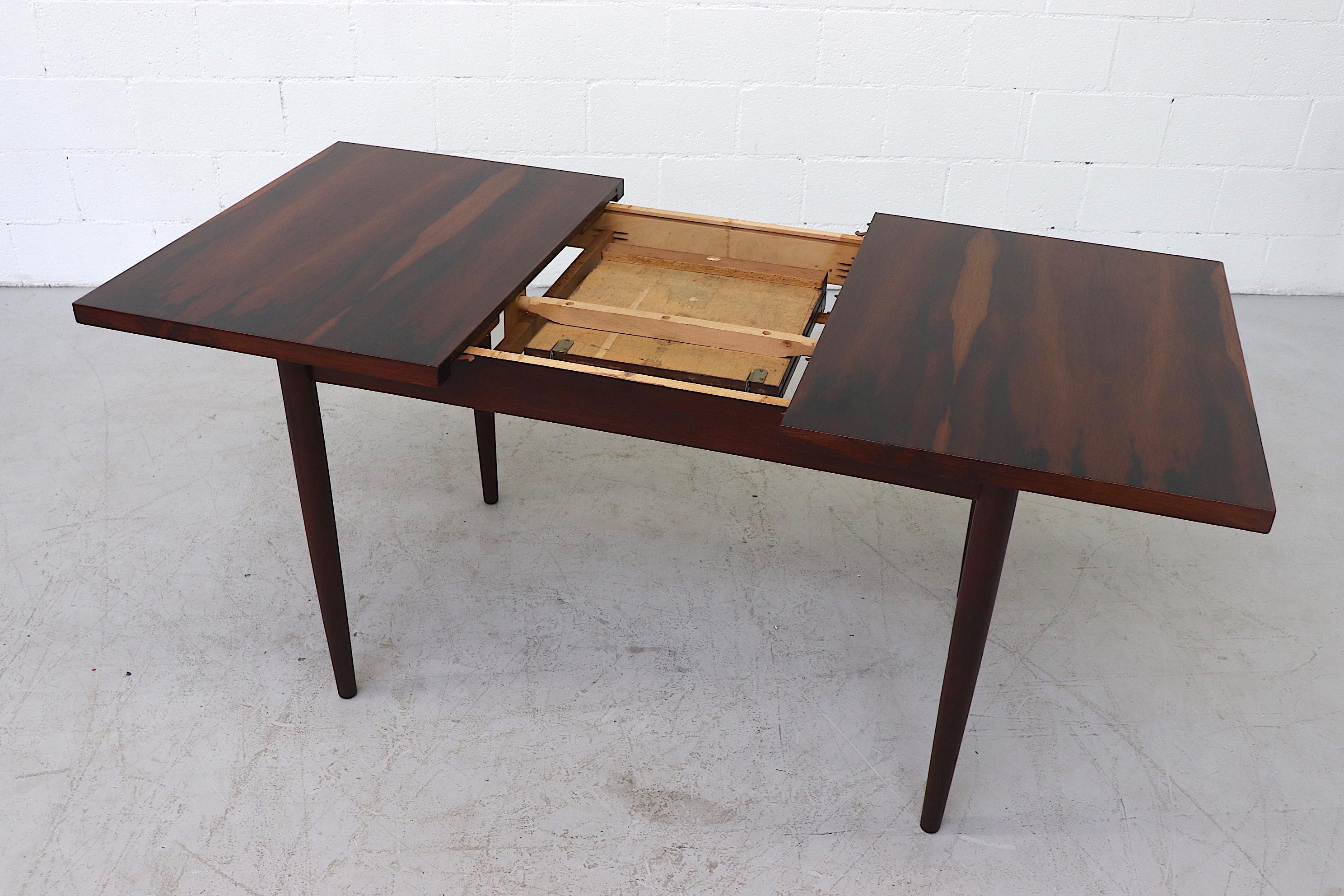 Midcentury Rosewood Dining Table with Hidden Leaf In Good Condition In Los Angeles, CA