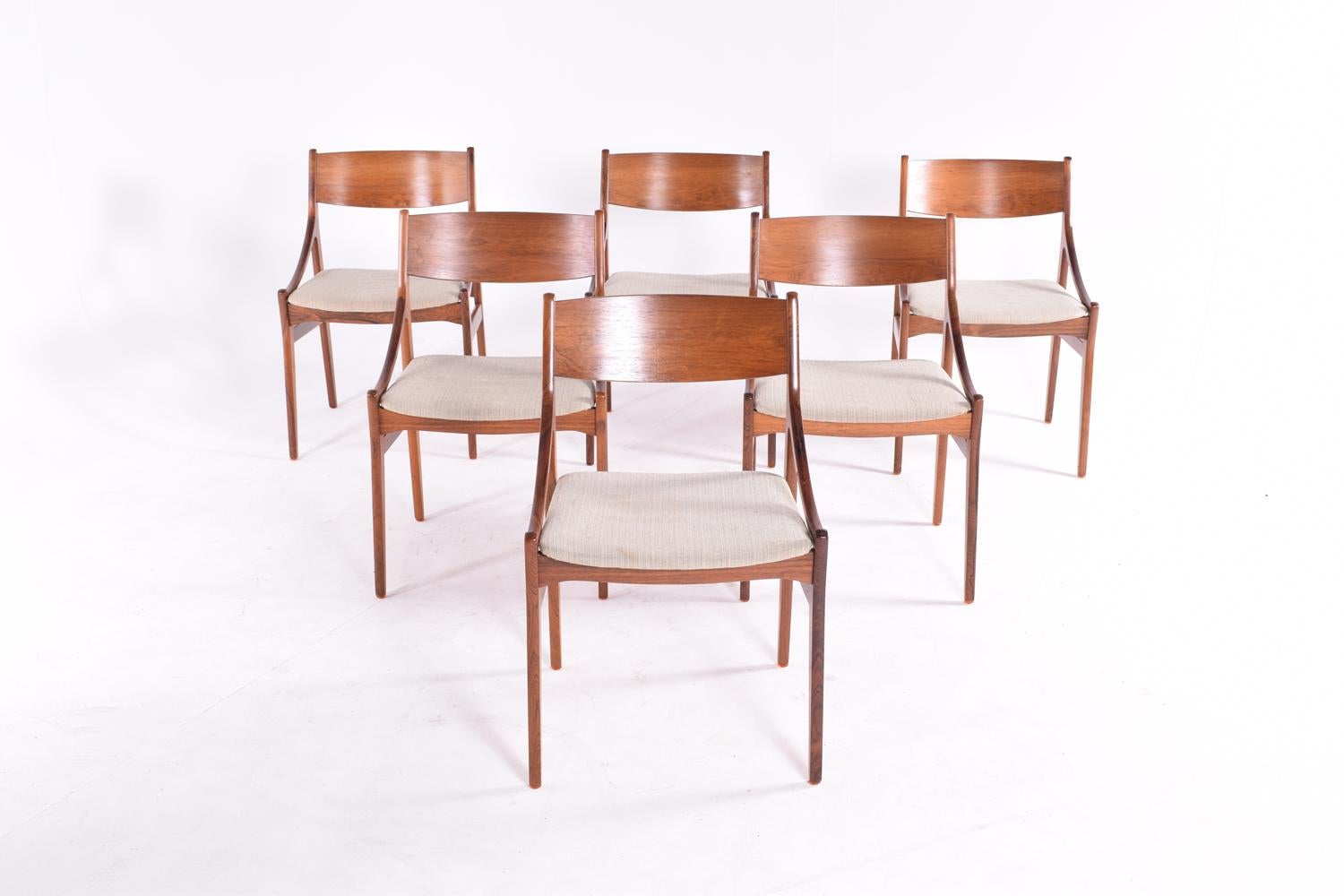 Midcentury set of six dining chairs by Vestervig Erikson for Brdr Tromborg Lystrup, Denmark, 1960s. 
These exceptional Danish dining chairs are made of rosewood with a beautiful veneer and a beige fabric seat. 
With very nice details this chairs