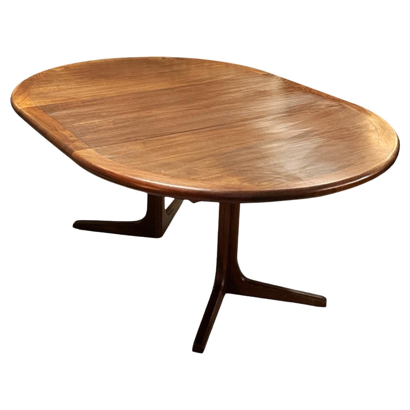 Mid Century Rose Wood Dinning Tales By Glen Of California. Wonderful Wooden table with three extra leaves that expand this table up to 107 inches in width. Beautiful Rose wood with spectacular grain. 
When no leaves are attached it forms a circular