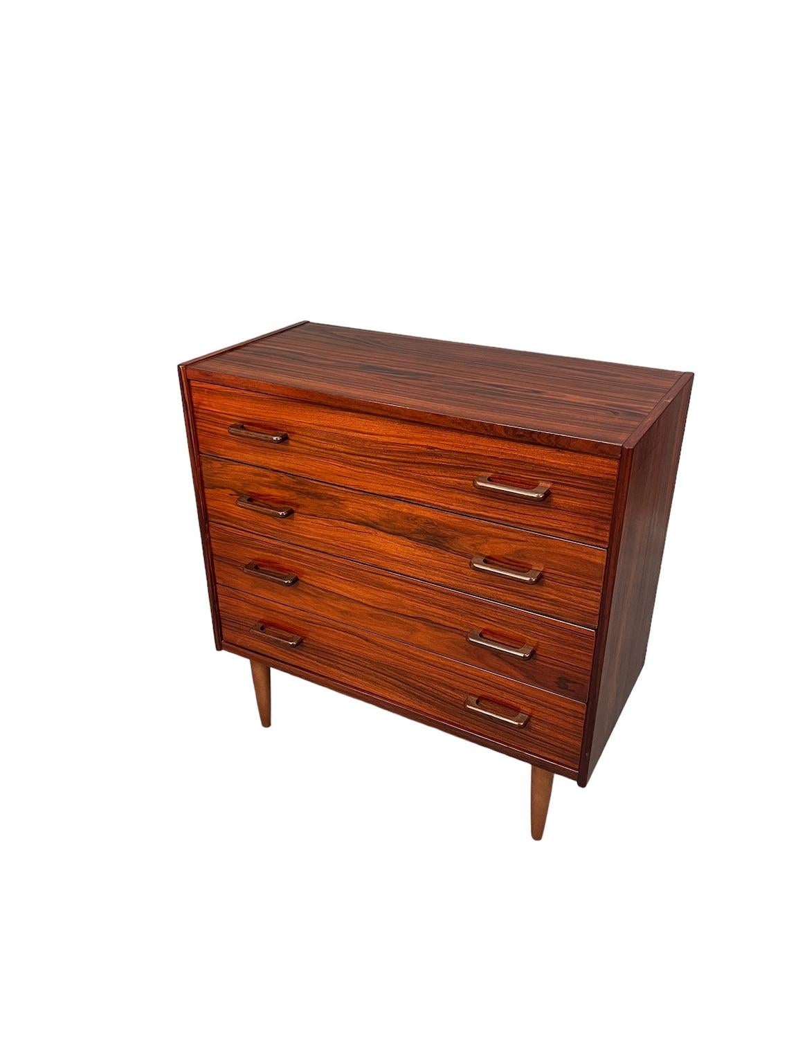 Mid-Century Rosewood dresser with 4 drawers 

Dimensions:
L:33 D:16 H:33 inches

Condition:
very good for age and use 