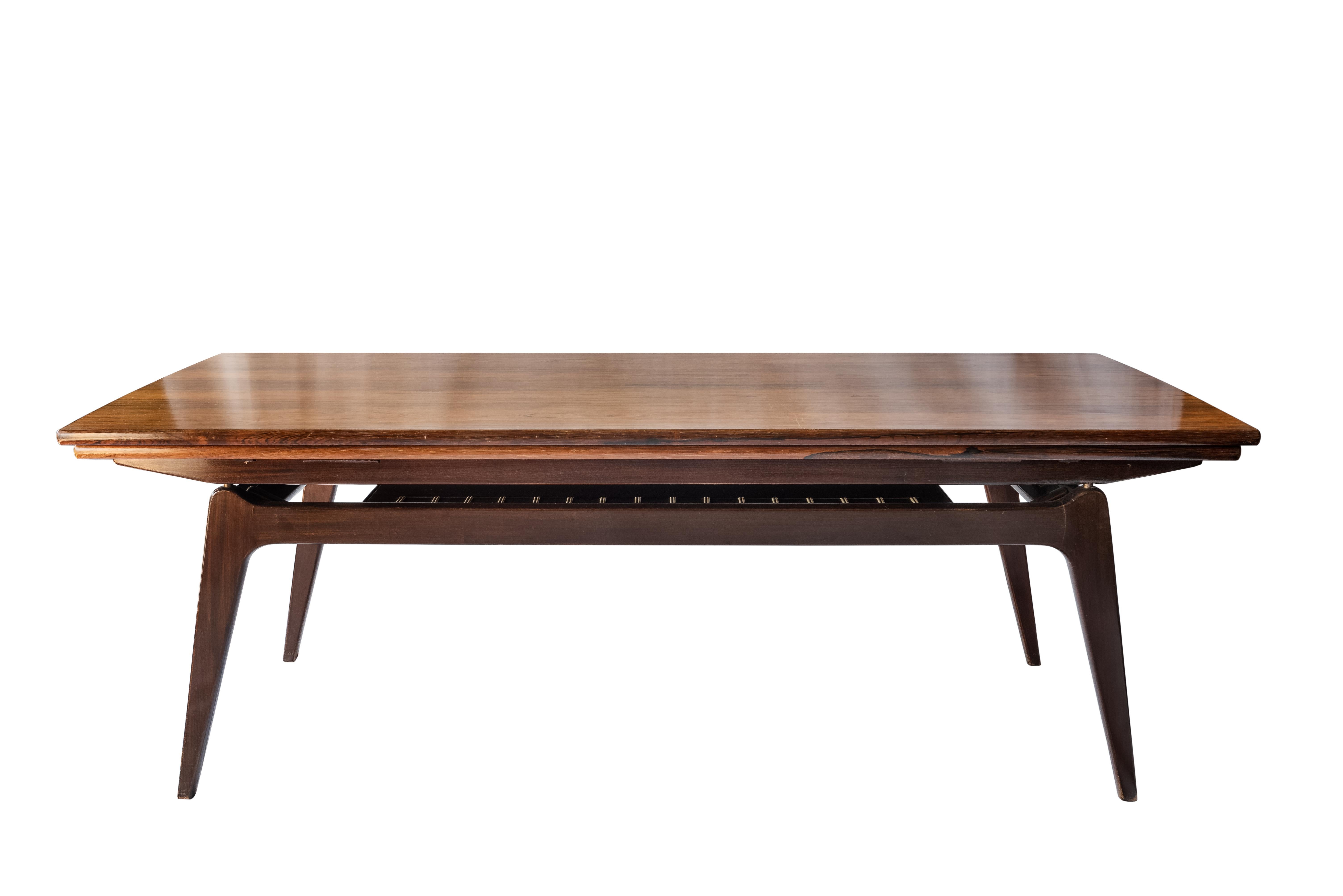 Midcentury Rosewood Metamorphic Elevator Coffee Dinner Table, B. C. Møbler, 1960's

This 1960 rare Danish rosewood coffee table, also known as the Elevator or Metamorphic table was designed to convert into a dining table big enough to seat six