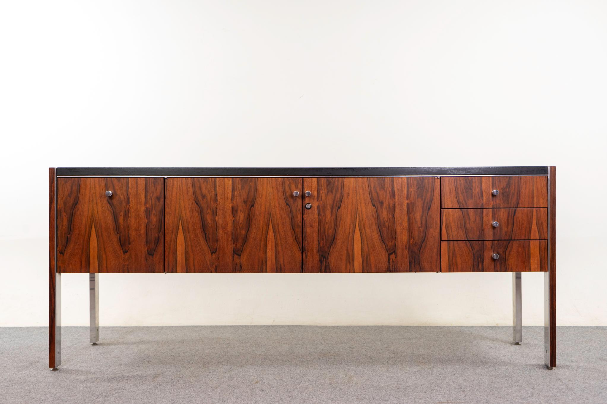 Rosewood, leather and chrome sideboard by Herman Miller for Billrite, circa the 1970s. Beautiful bookmatched rosewood veneer doors and drawer fronts, stunning grain patterns throught! Unique contrasting jet black leather top and polished chrome