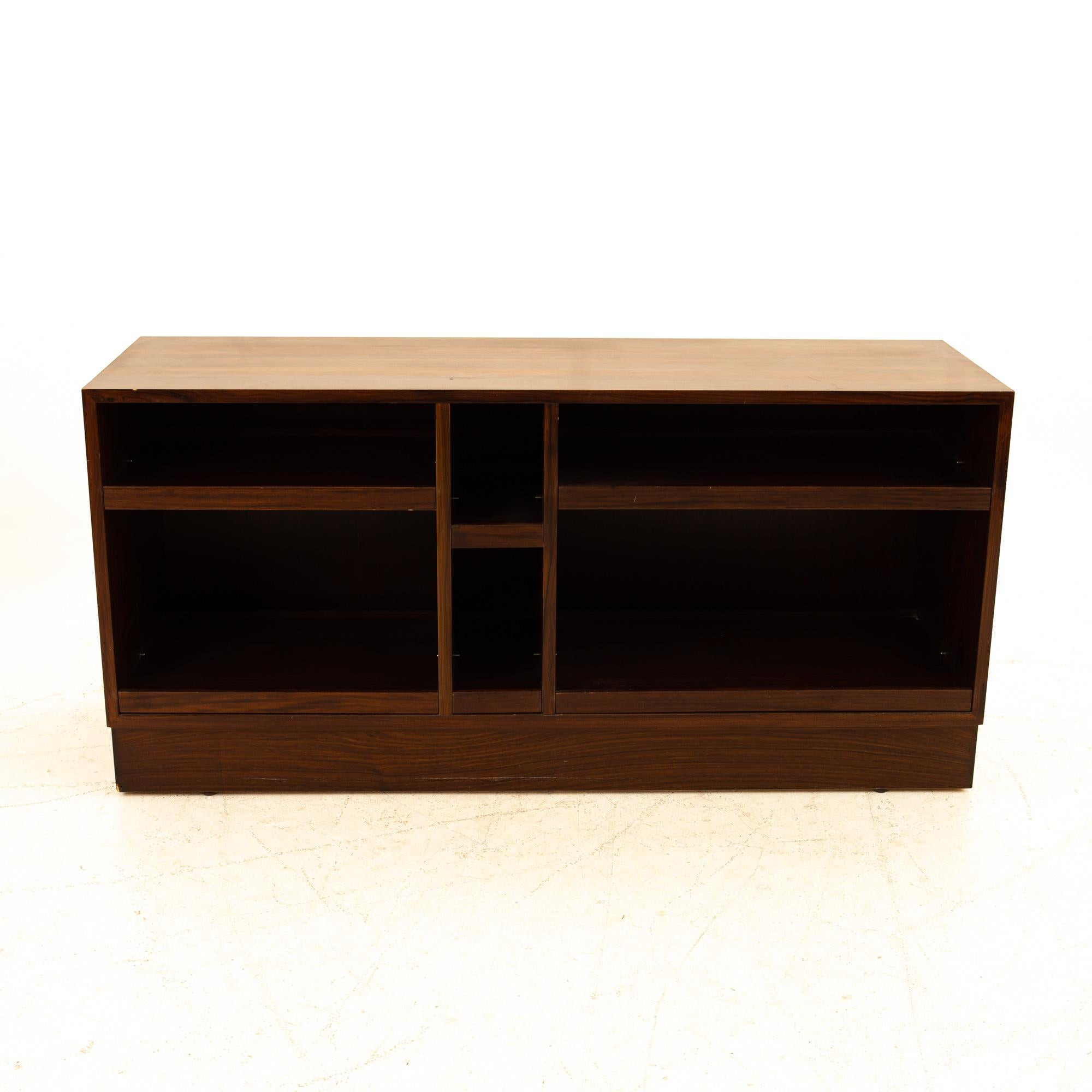 Mid Century rosewood media cabinet credenza
Entertainment center measures: 54.5 wide x 16.75 deep x 26.25 high

All pieces of furniture can be had in what we call restored vintage condition. That means the piece is restored upon purchase so it’s
