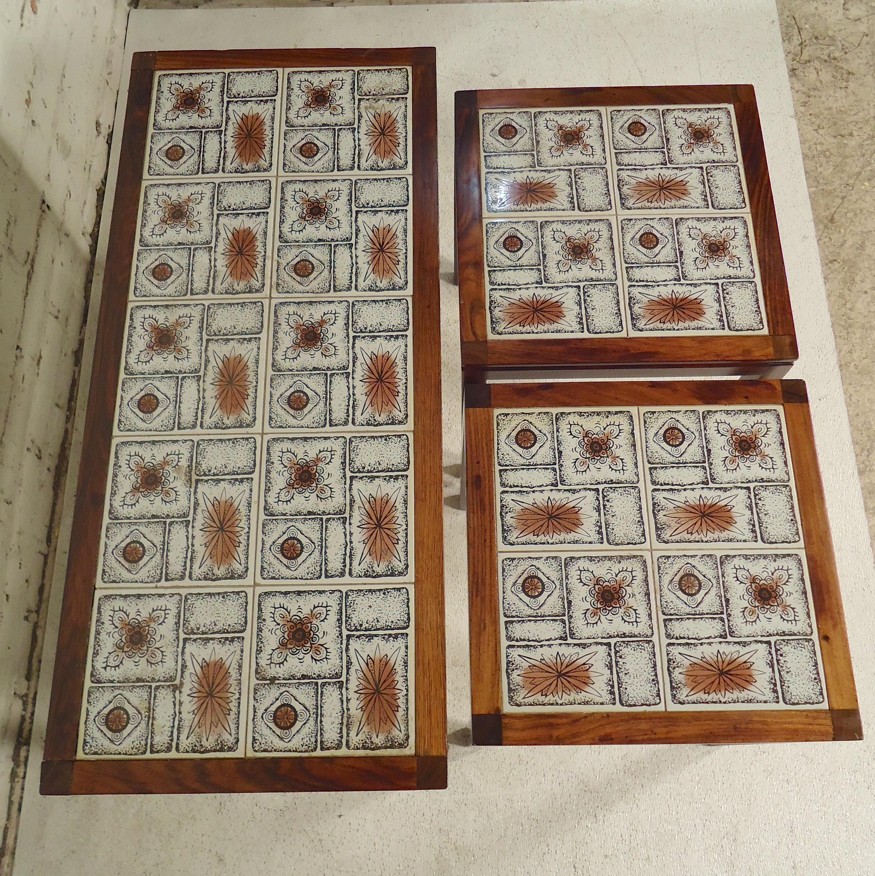 Set of three tile top tables with rosewood frames. Two tables nest inside the larger table.

(Please confirm item location - NY or NJ - with dealer).
  