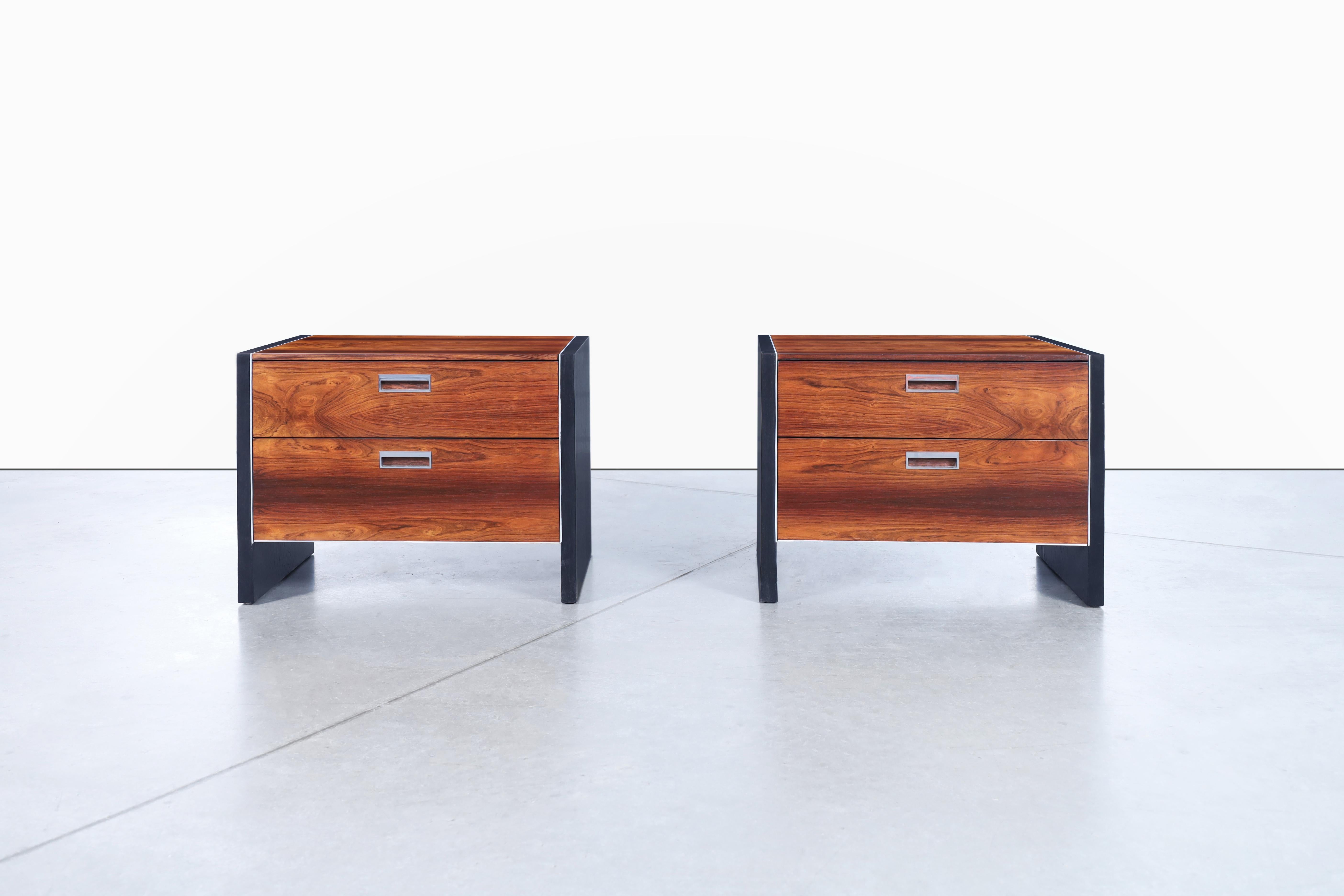 These mid-century rosewood nightstands are a true testament to timeless design and craftsmanship. Designed by Robert Baron for Glenn of California in the 1960s, each nightstand showcases the unparalleled beauty of Brazilian rosewood. The exquisite