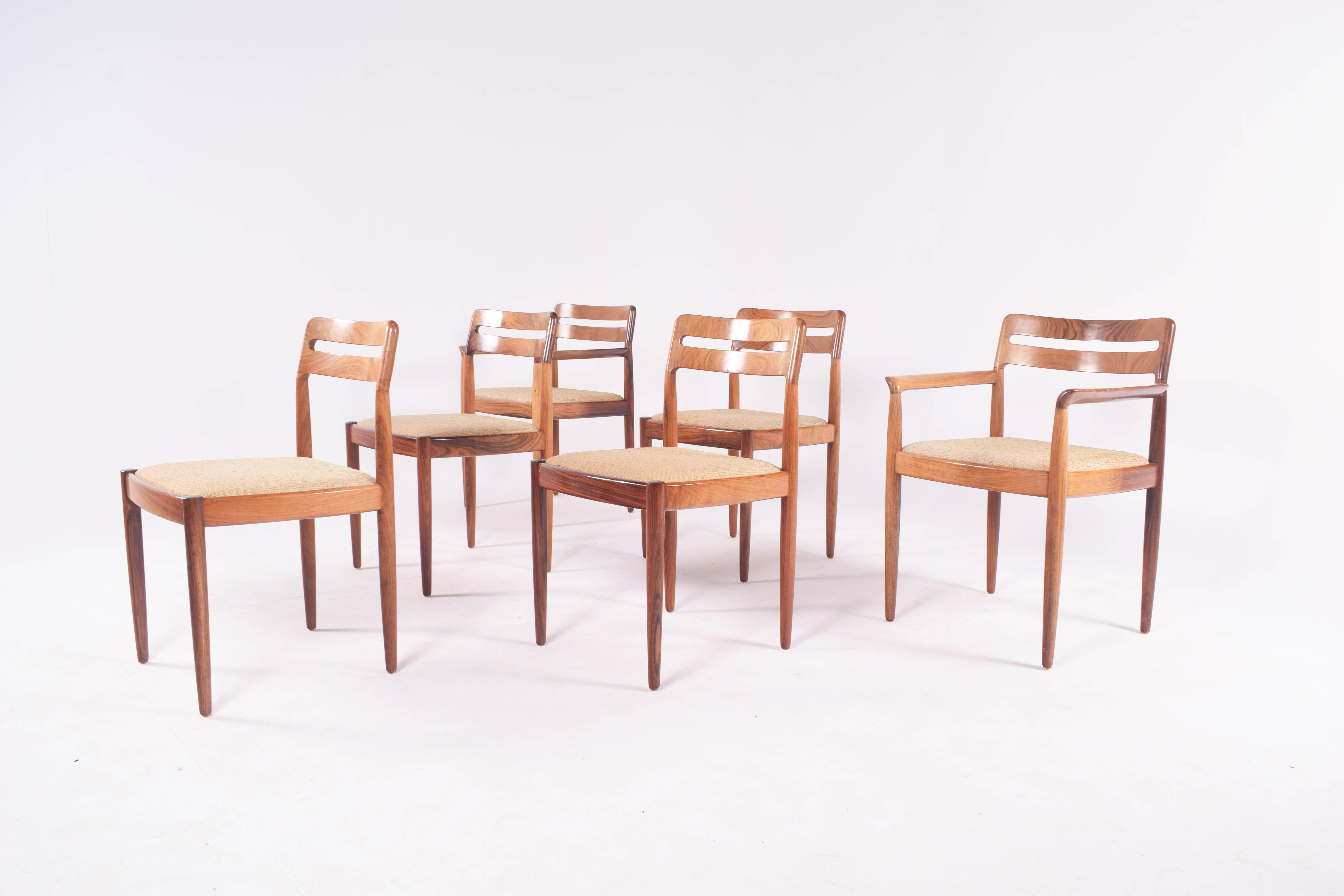 A lovely set of rosewood dining chairs by H.W. Klein for Bramin. Two armchairs and 4 chairs. The entire frame is constructed of solid rosewood making them a good choice for a dining chair. Klein's pieces for Bramin use high standards of material