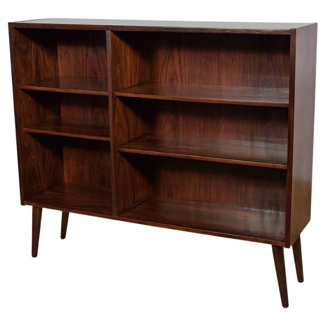 Bookcase made of rosewood in Denmark in the 1960s. The bookcase has interesting graining. Adjustable shelf height. The furniture has been completely renovated, cleaned of the old surface, painted rosewood stain and finished with very quality danish