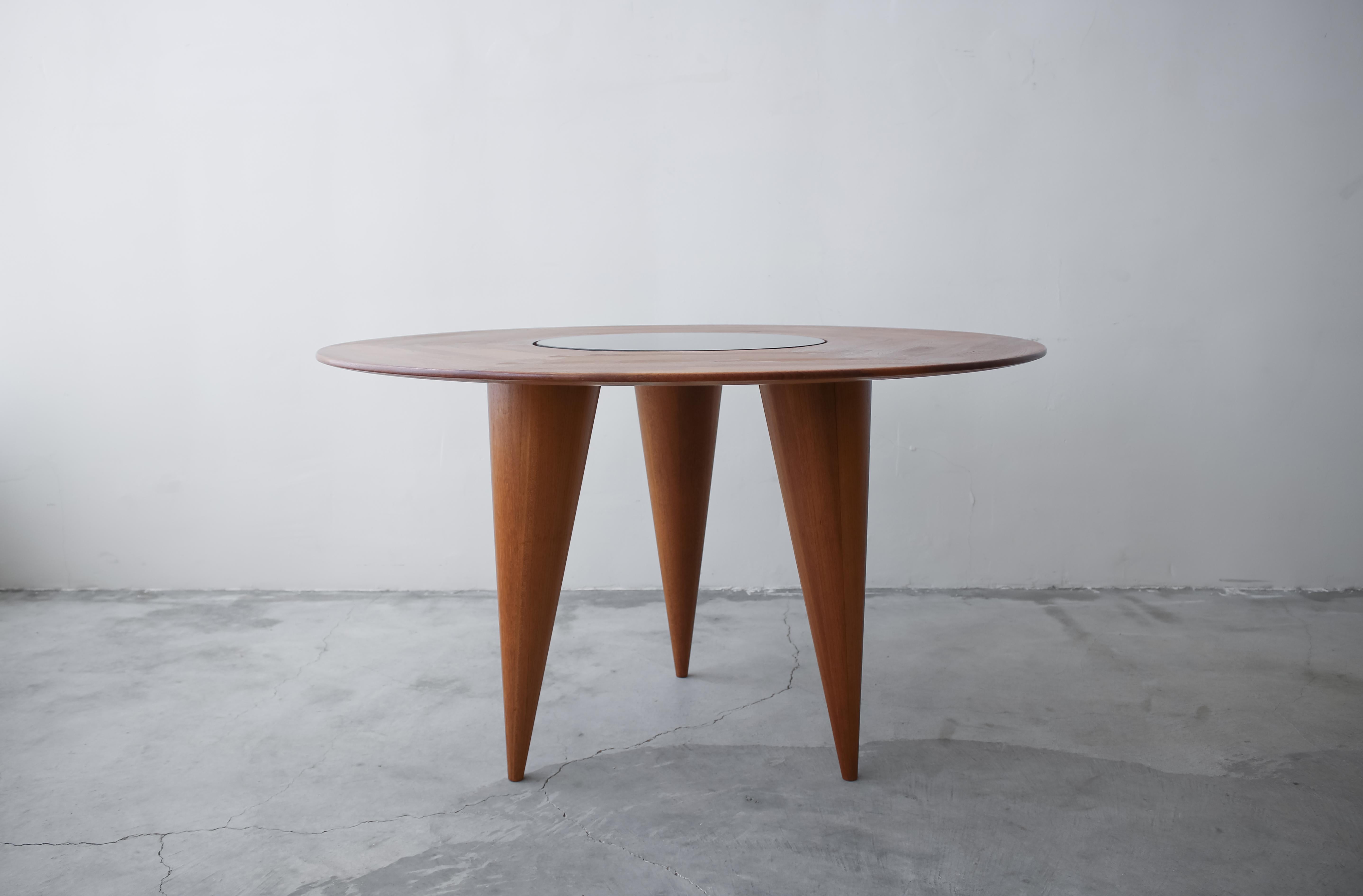 Looking for a unique small space dining table with lots of character, or better yet a gorgeous center table? This 3 legged solid teak table is absolutely stunning. Table is constructed using puzzle joints joining the solid wood pieces of the top and