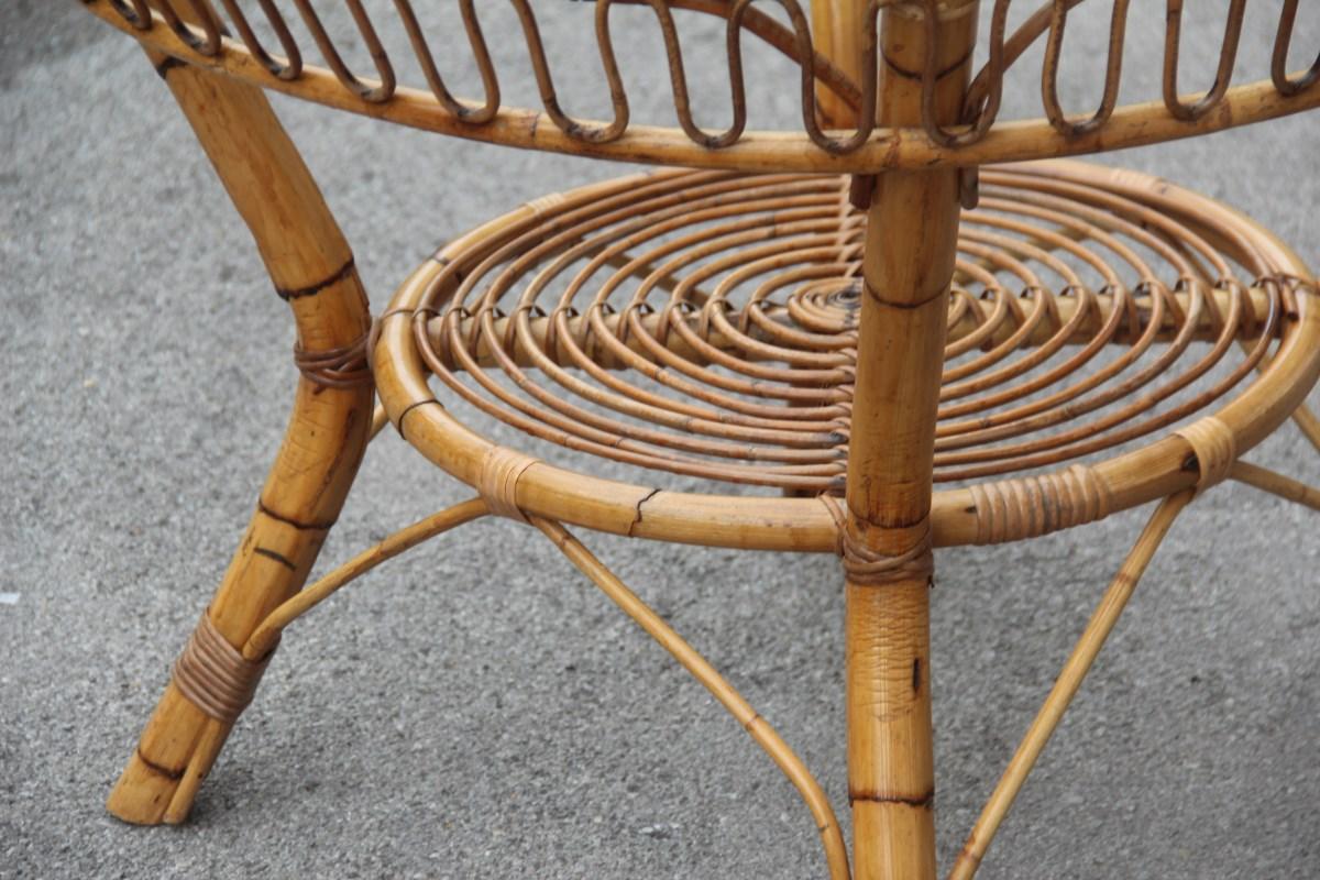 Midcentury round Casa del Bambù dining table Italian design glass top for garden.

Elegant and refined in its execution, entirely handmade by skilled artisans now disappeared.