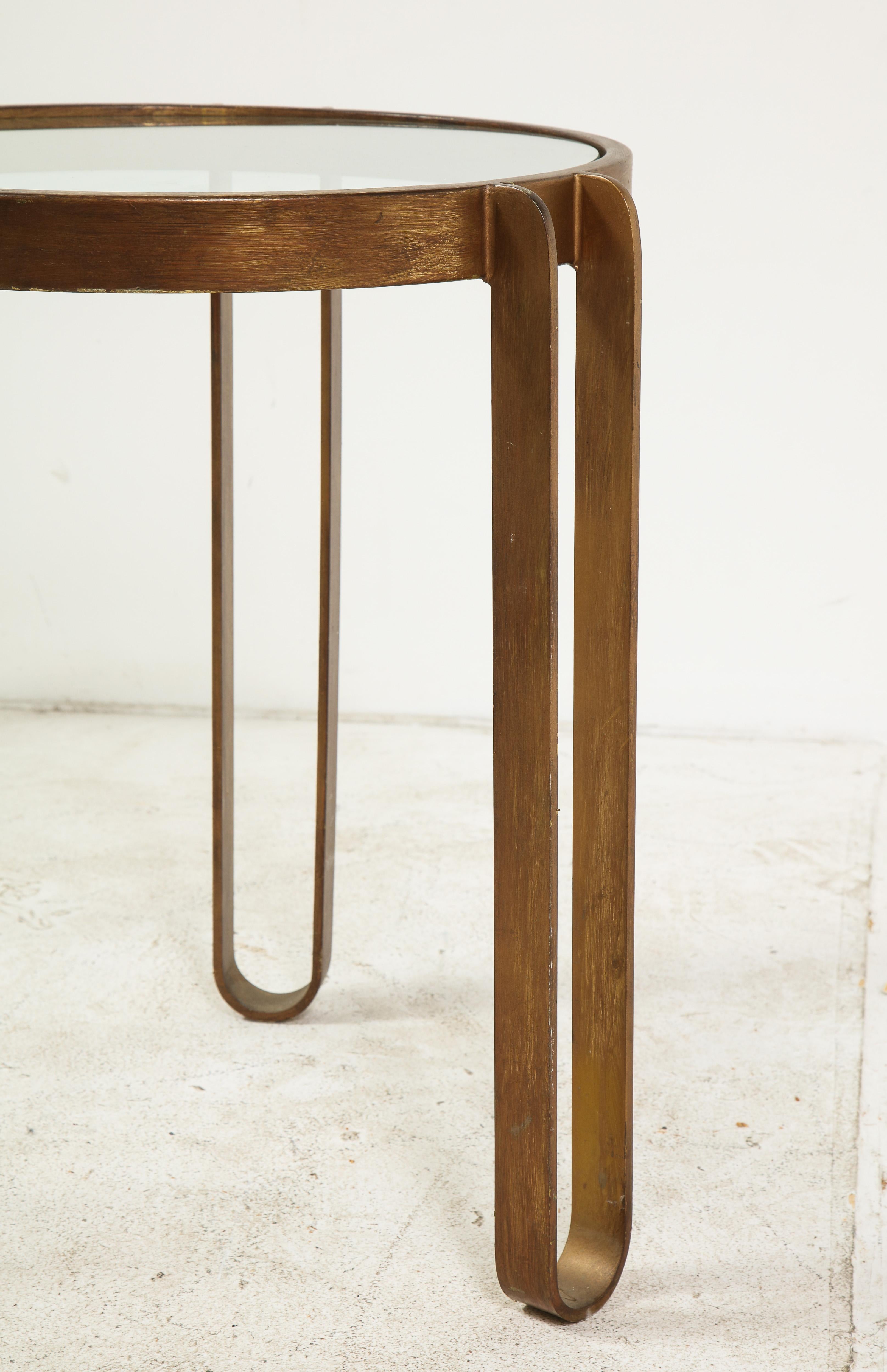 Round brass and glass side table with three hairpin legs, German, 1940s.