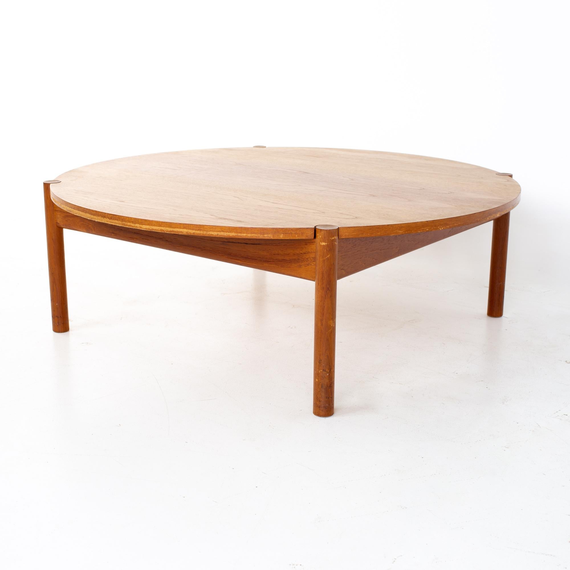 Mid century round Danish coffee table
Table measures: 45.25 wide x 45.25 deep x 15 inches high

All pieces of furniture can be had in what we call restored vintage condition. That means the piece is restored upon purchase so it’s free of