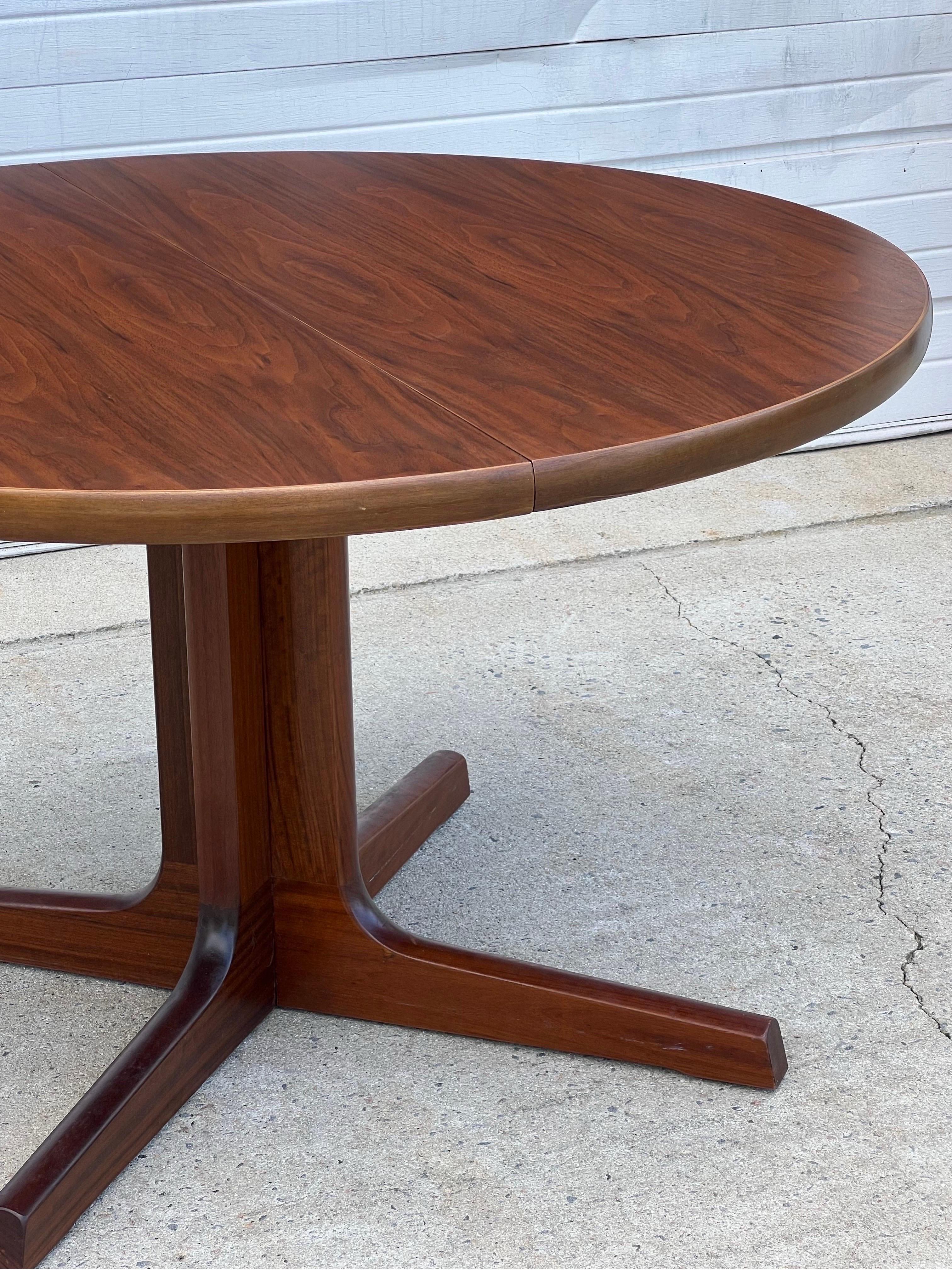 A beautiful vintage Danish pedestal dining or game table has just become available and recently refinished. Extraordinary grain though out the top displaying wonderful cathedrals. A great size for apartments, breakfast nooks or smaller fit dining