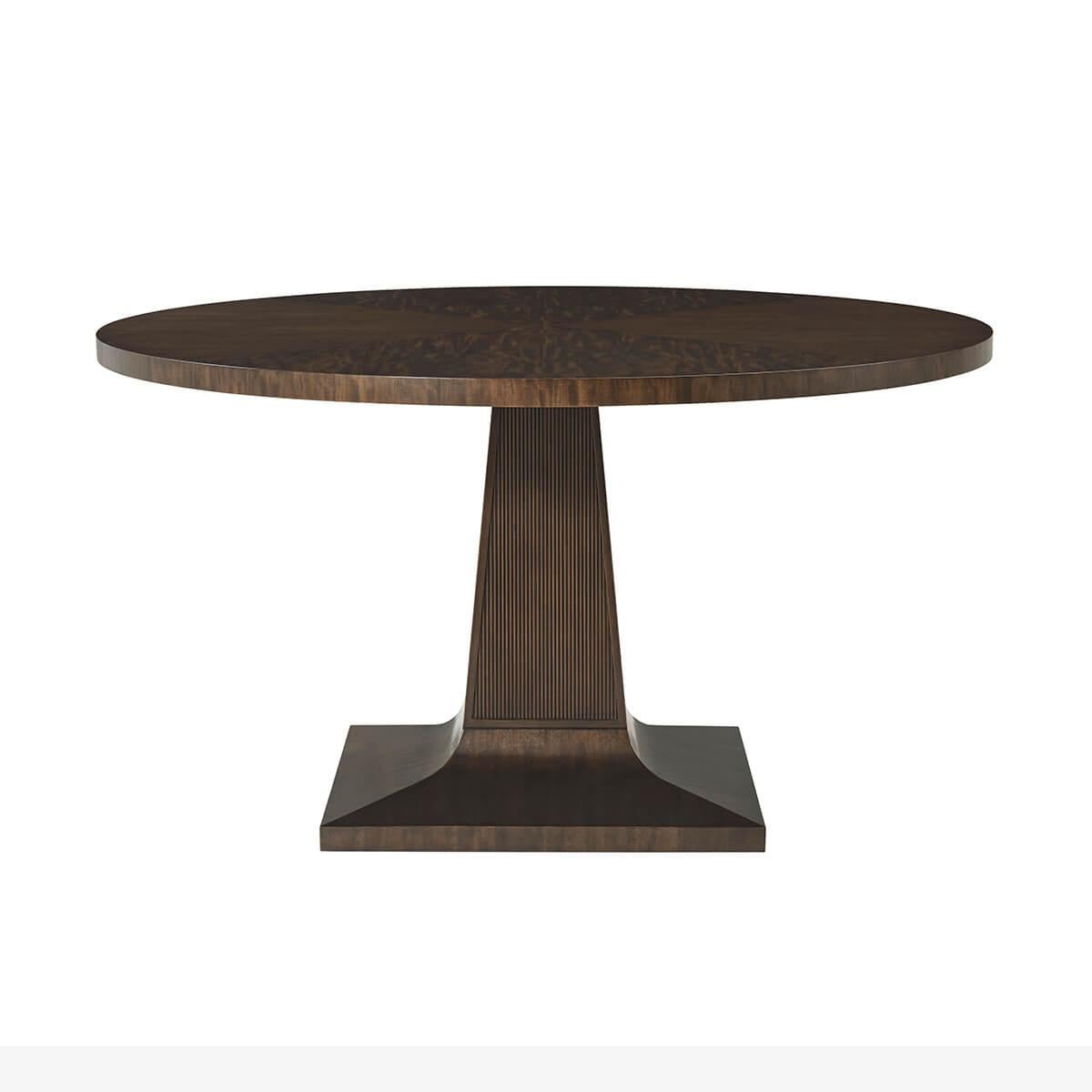 Mid Century Round Dining Table - 54, crafted from a Prima Vera in our deep Bistre finish, is set upon a sophisticated tapering square base with reeded carving details. 
Dimensions: 54 