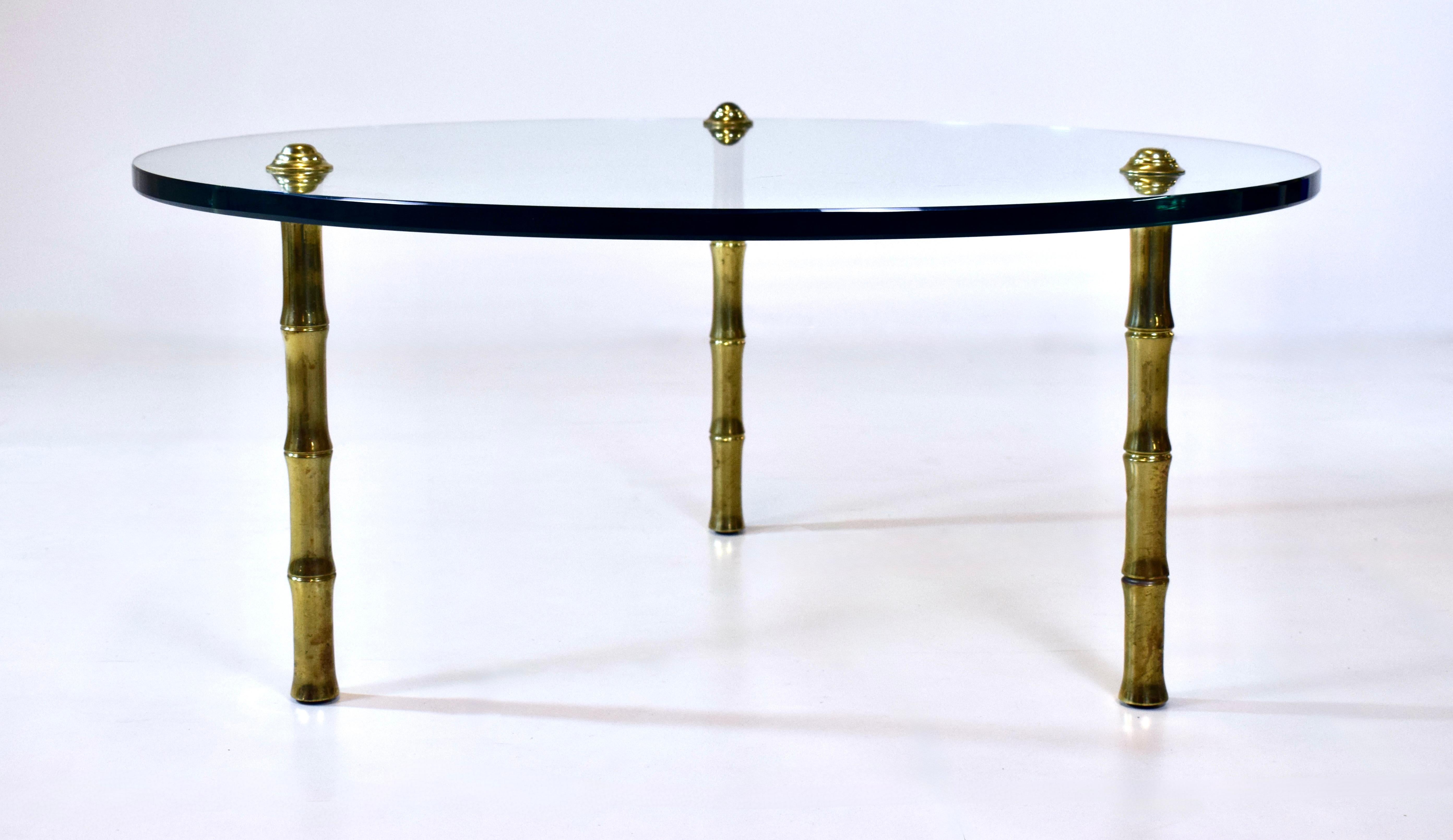 1960's round glass coffee cocktail table with solid brass faux bamboo legs.  Strikingly similar design elements as seen Pepe Mendoza Artisan Brass Coffee Tables.