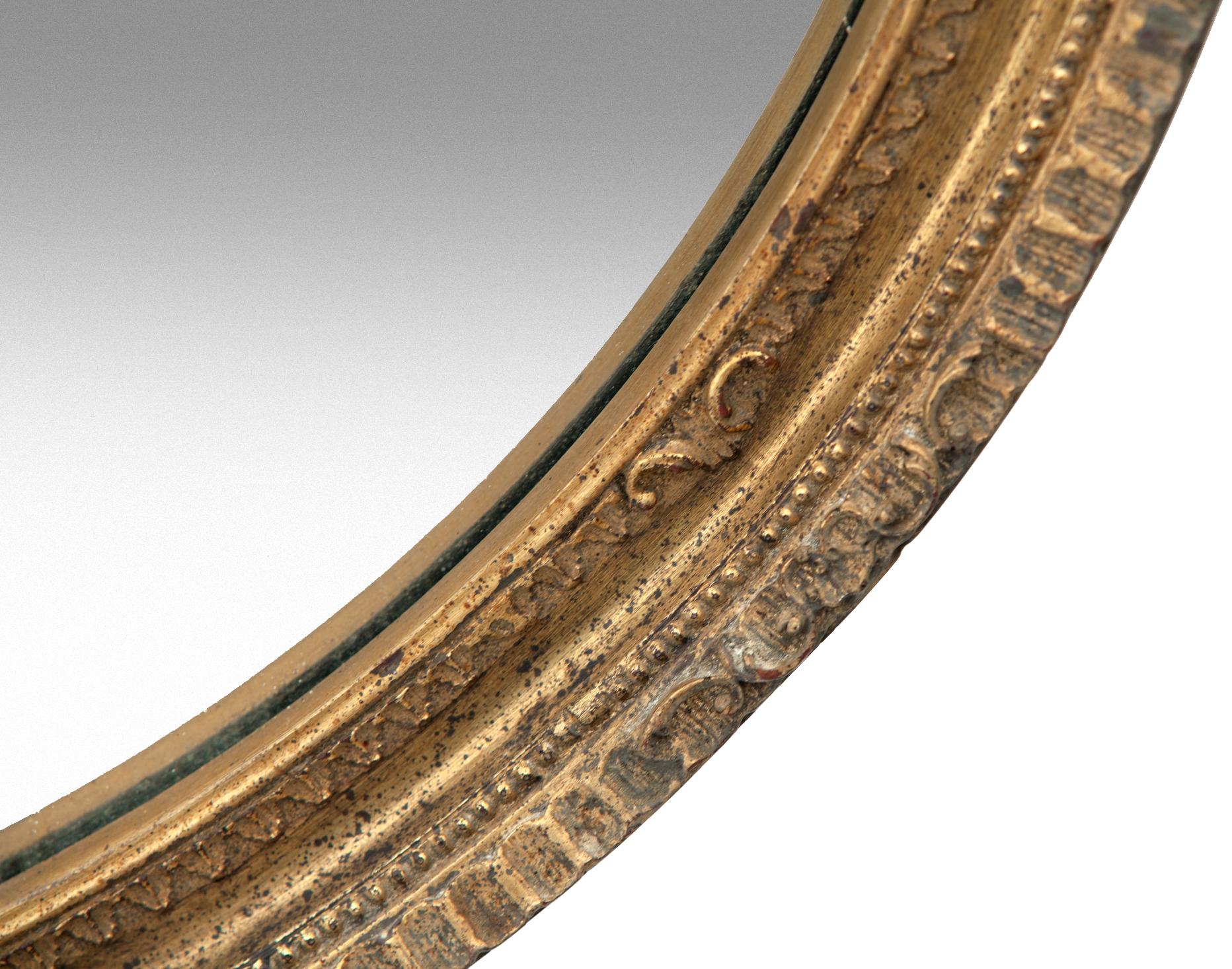 Midcentury round European gold framed mirror/ a ruffled edge.
This stunning frame is really quite simple, with a shallow ruffled edge & a petite inner frame finished in both light & dark gold.
