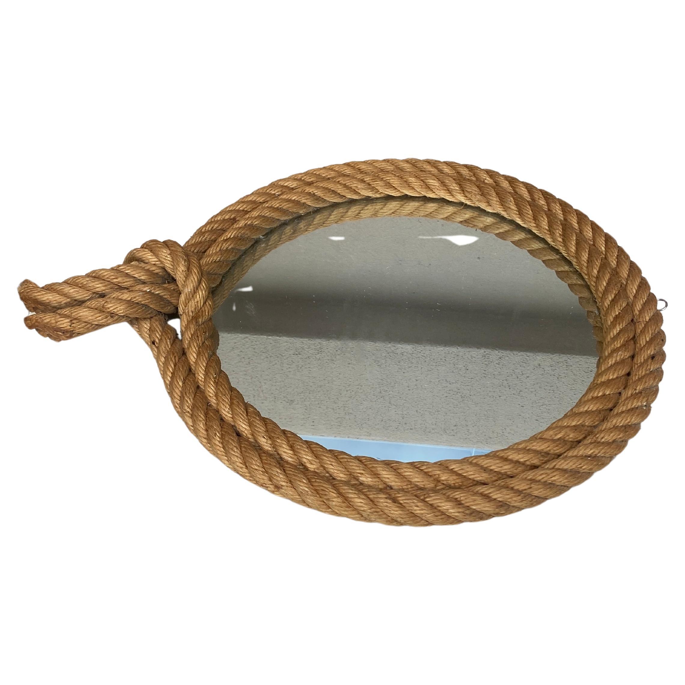 Unusual French round rope mirror Audoux Minet, circa 1960.
Lariat shape.
Measures: Width / 13.3 inches.
Height / 17 inches.