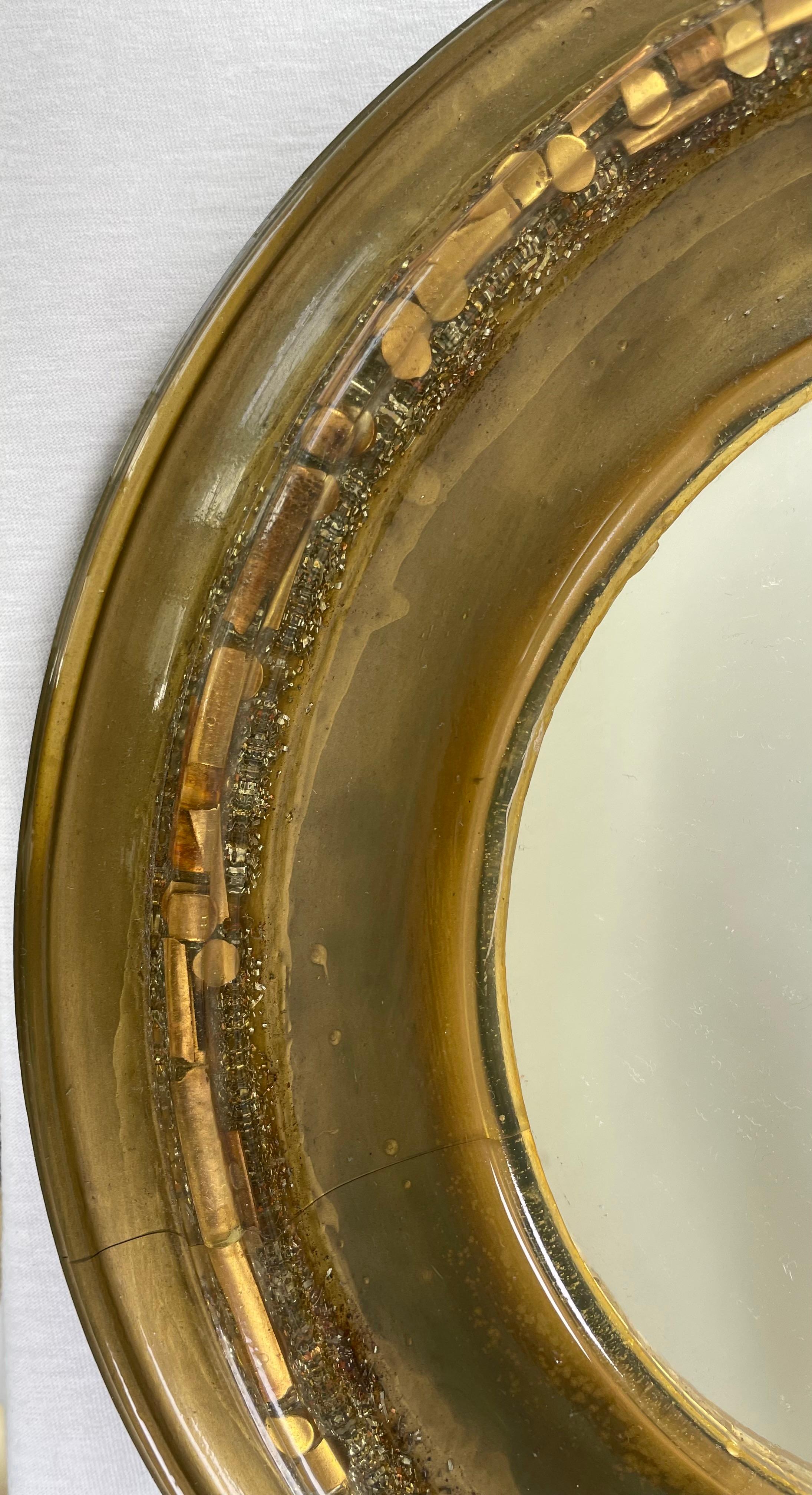 Resin mirror with inclusions of golden sequins of different shapes. Handmade mirror in the south of France in the 1960s.