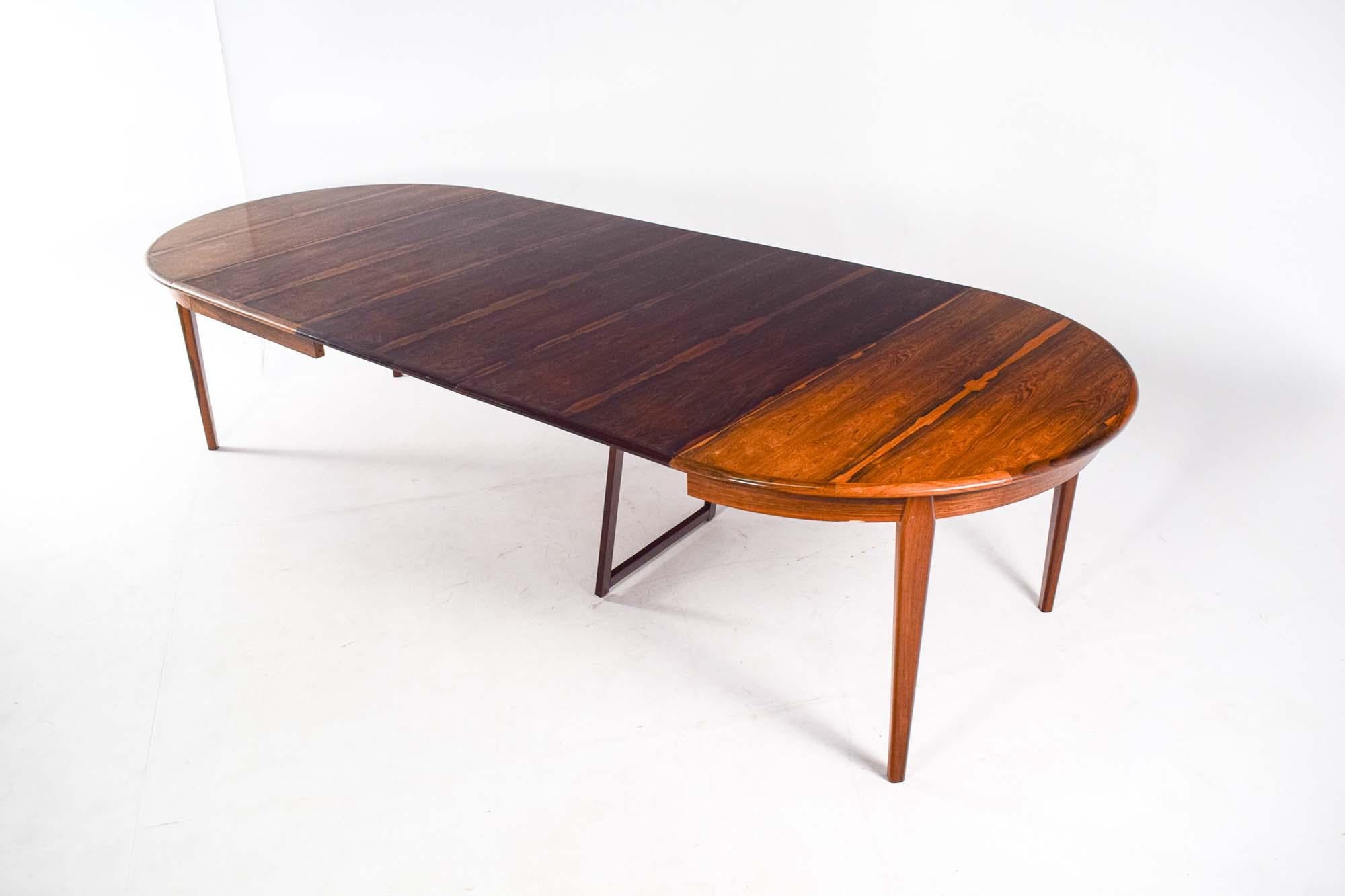 Mid-20th Century Mid Century Round Rosewood Extendable Dining Table by H. Sighs & Sons