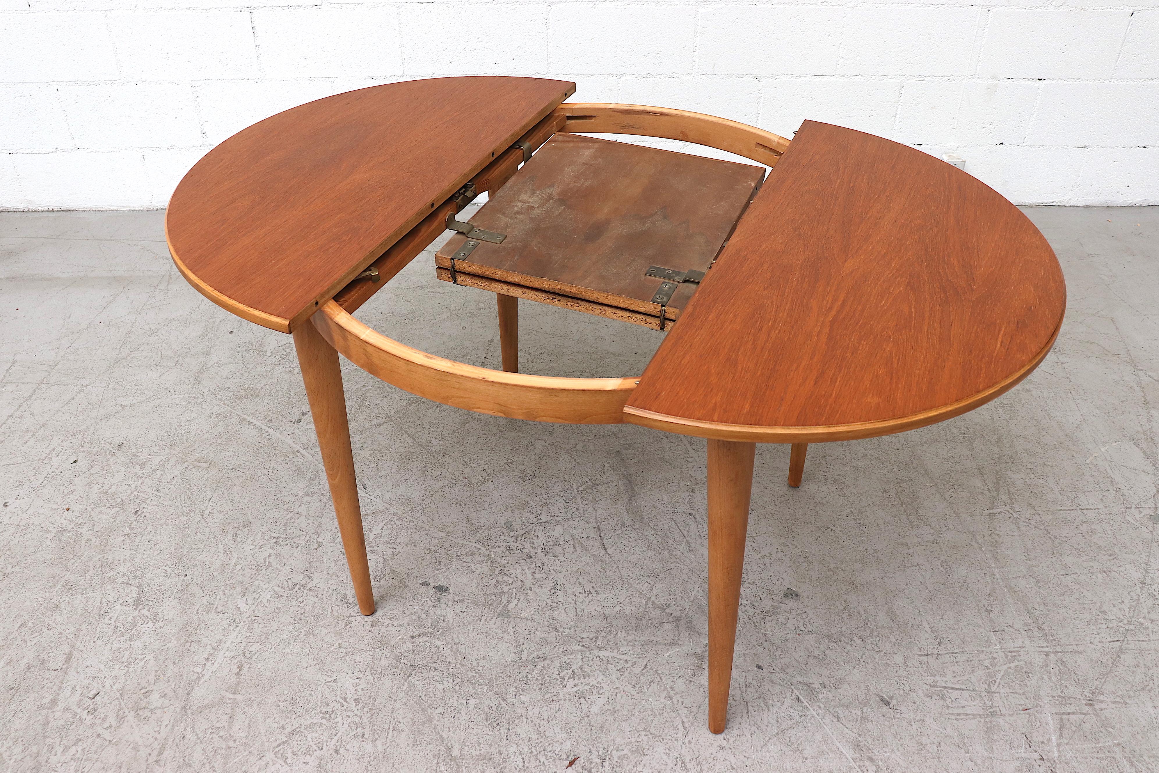 Mid-20th Century Midcentury Round Teak Dining Table with Hidden Leaf