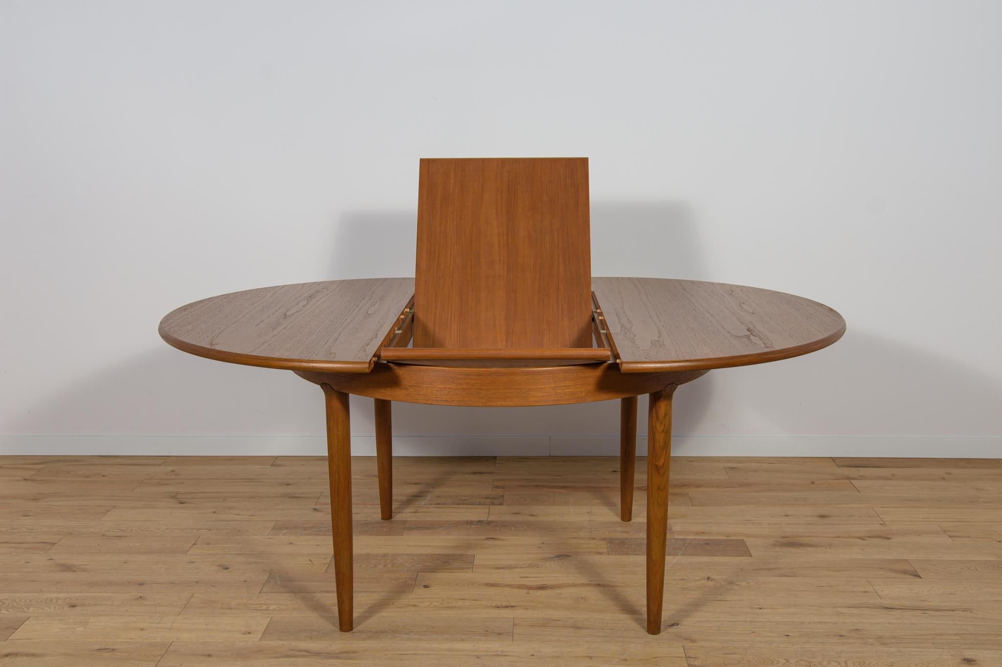 Mesa de comedor redonda extensible de teca de mediados de siglo, United Knigdom, años 60 mediados del siglo XX en venta