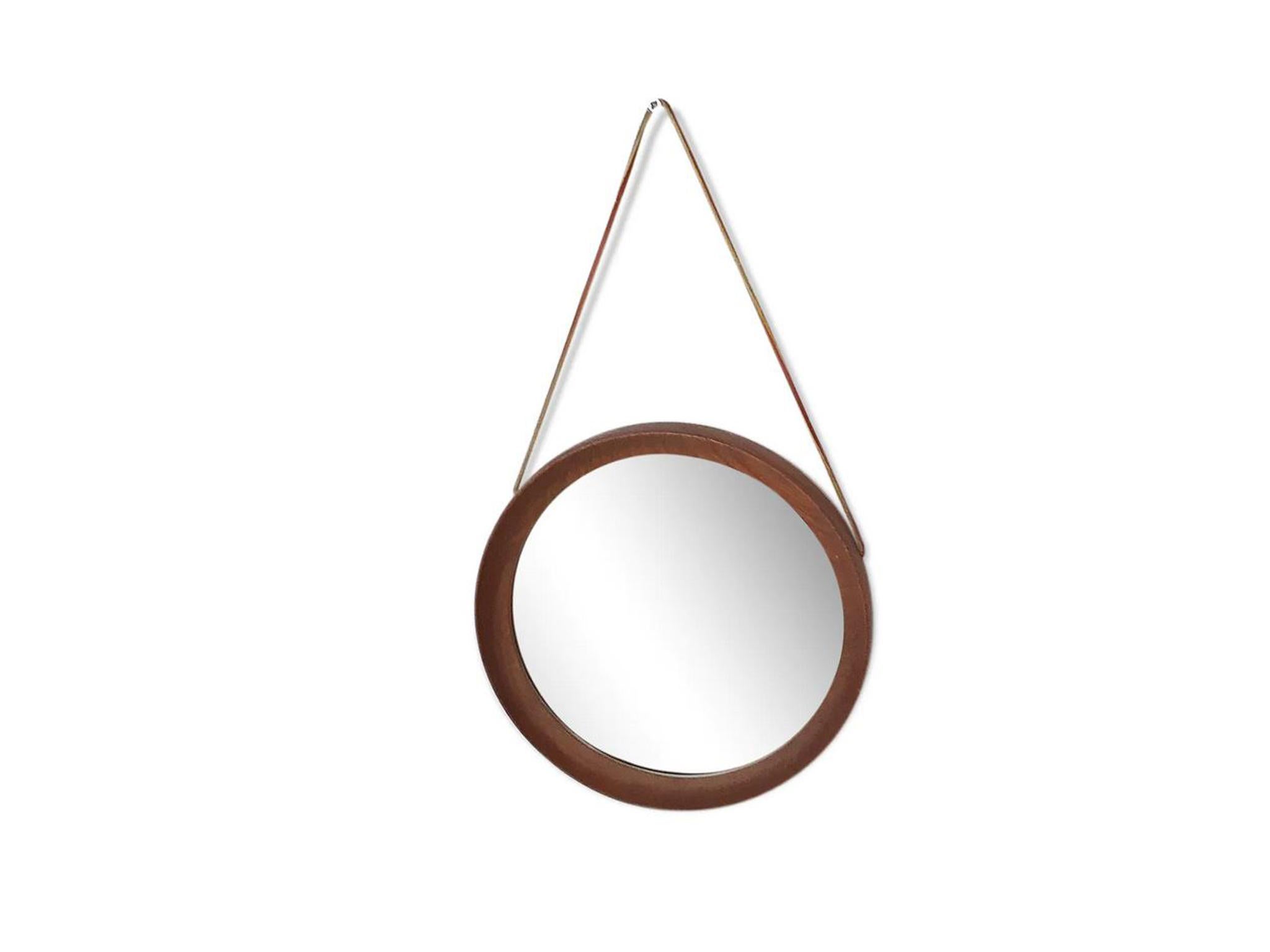 Round teak mirror with a new leather strap.