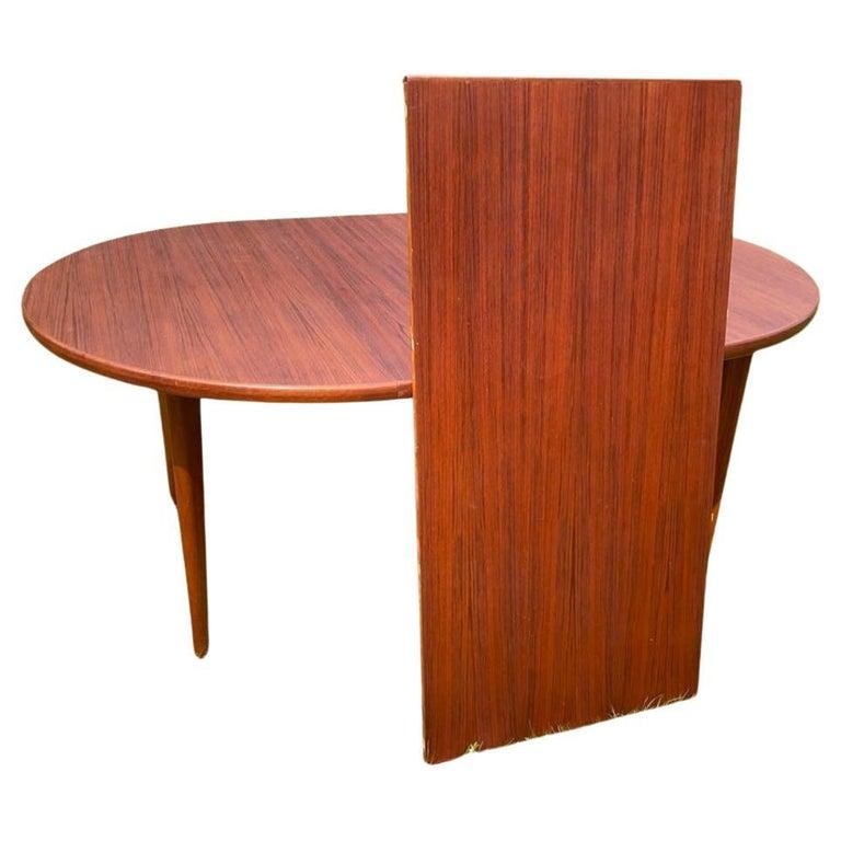 Stunning mid century Teak round swedish Modern extension dining table with (2) leaves. Designed by Karl-Erik Ekselius and made By J.O. CARLSSON. This table is in beautiful condition with reddish brown teak tones very great modern Dining Table. high
