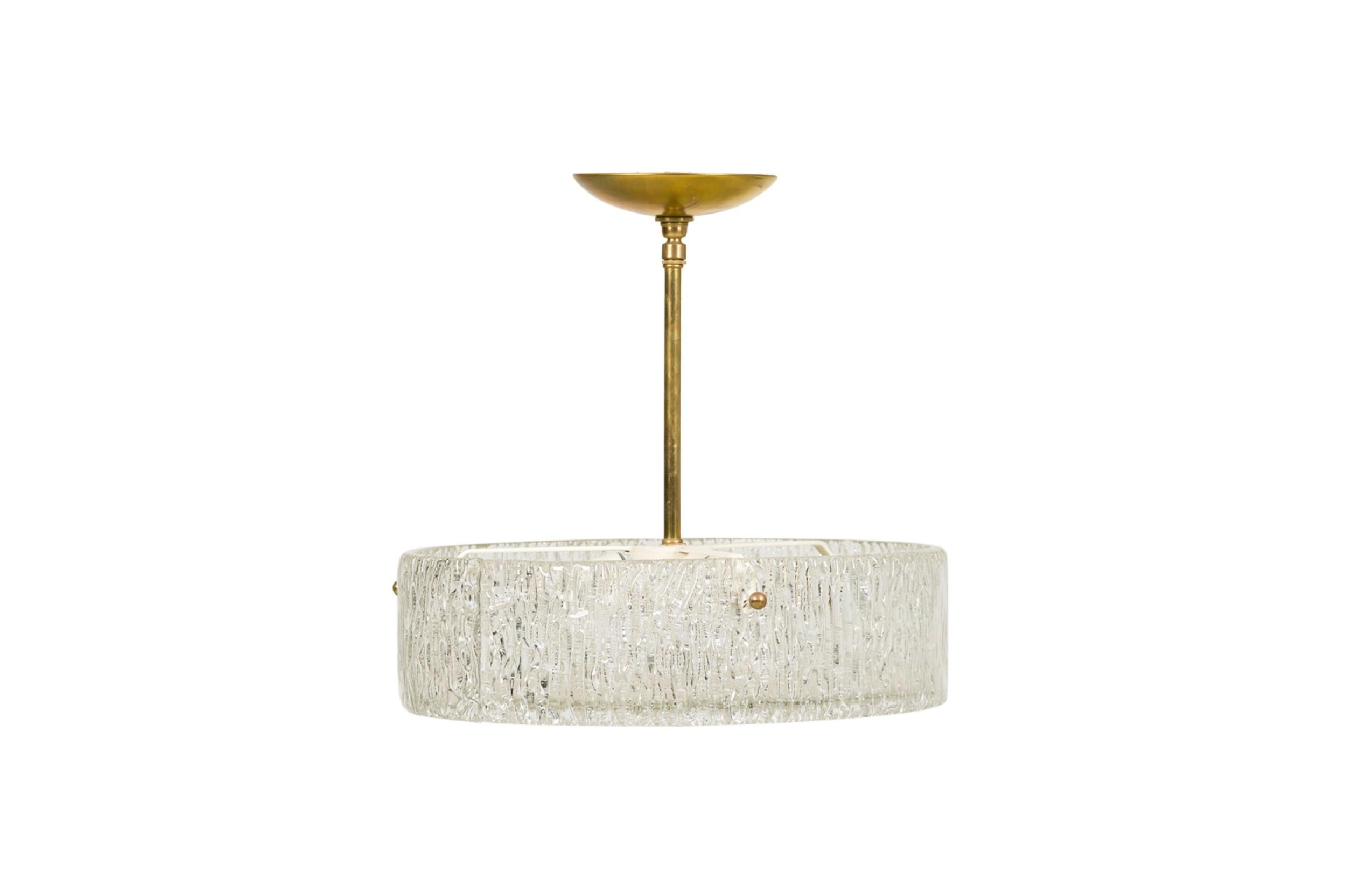 2 Mid-Century (possibly Scandinavian) clear textured glass chandelier with a flat round disc form bottom supported with a small brass center finial (PRICED EACH)