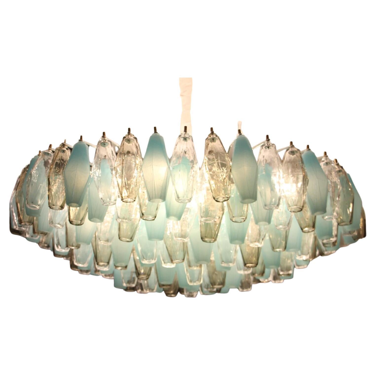 This beautiful chandelier or flush mount features 193 pieces of Murano glass poliedri pieces. Each piece of glass has been made individually by hand in Murano and shows abstract diamond faceted shape. Colors of glass are very particular as they are