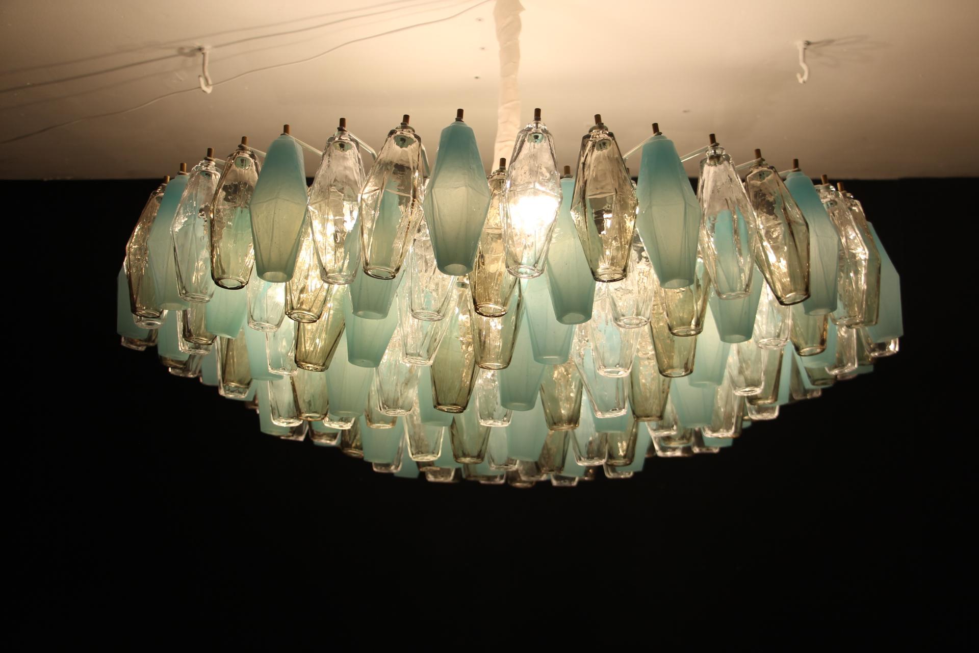 This beautiful chandelier or flush mount features 193 pieces of Murano glass poliedri pieces. Each piece of glass has been made individually by hand in Murano and shows abstract diamond faceted shape. Colors of glass are very particular as they are
