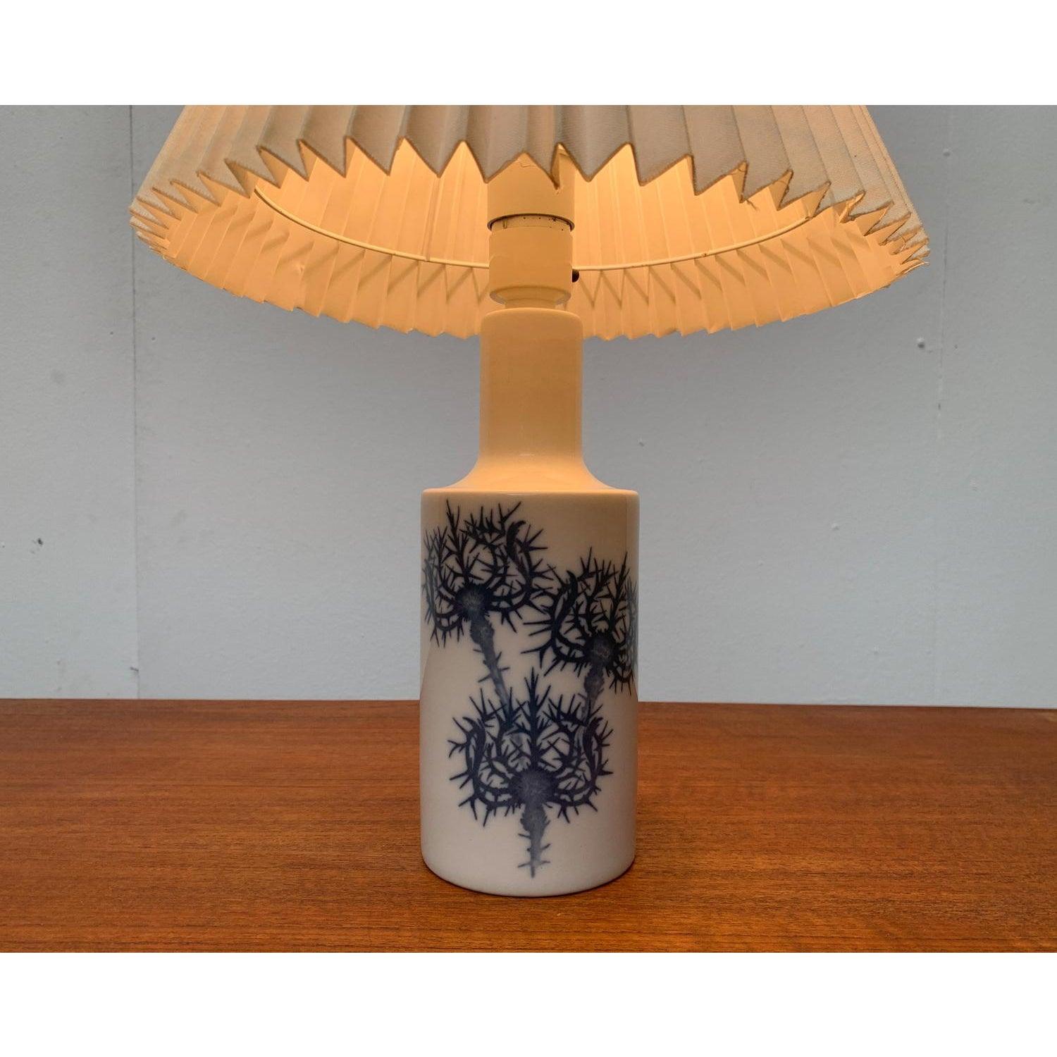 Classic table lamp from the Danish manufacturer Fog & Mørup and the renowned porcelain manufacturer Royal Copenhagen, designed by Kai Lange from the 60s.

Elegant shape and classic blue and white color scheme. These lights series was developed in