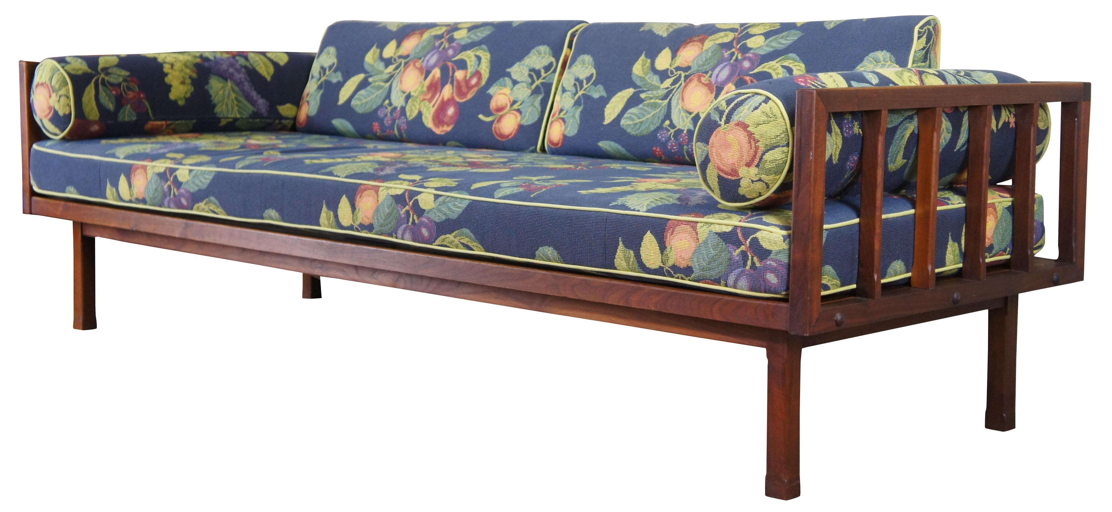 Vintage mid century lounge sofa or couch designed by John Stuart for Rubee Furniture Company of Chicago. Made of Rosewood featuring Danish styling and a blue floral still life of fruit styled upholstery. Measure: 82