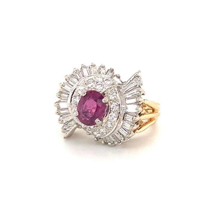 One mid-century ruby and diamond 14K yellow and white gold ring centering one pinkish-red ruby weighing approximately 1.50 ct. surrounded by 42 tapered baguette and round brilliant cut diamonds totaling approximately 1.25 ct.

Pristine, gorgeous,