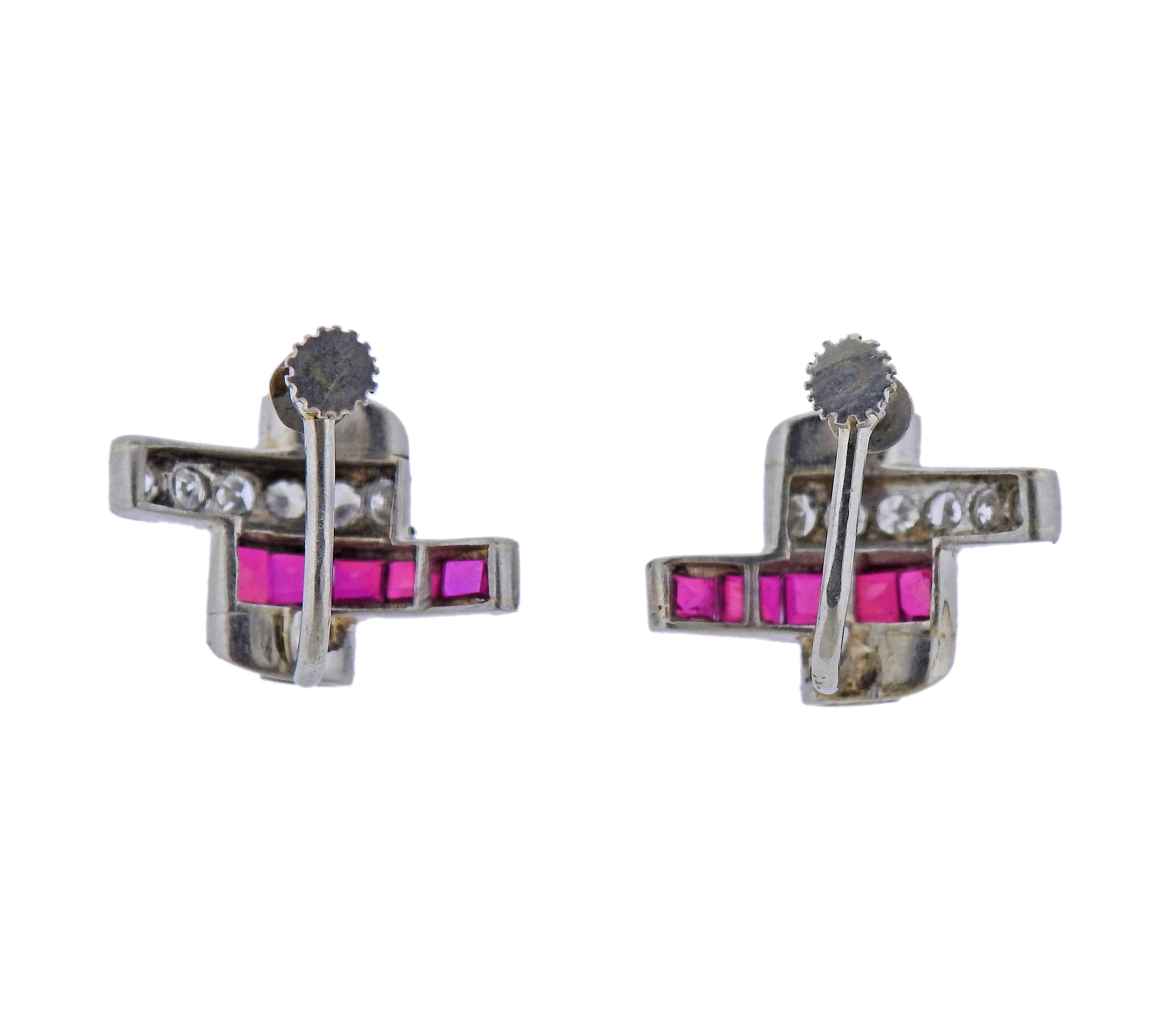 Pair of Mid Century platinum earrings with rubies and approx. 0.80ctw in diamonds. Earrings are 13mm x 20mm. Weight - 7.9 grams. 