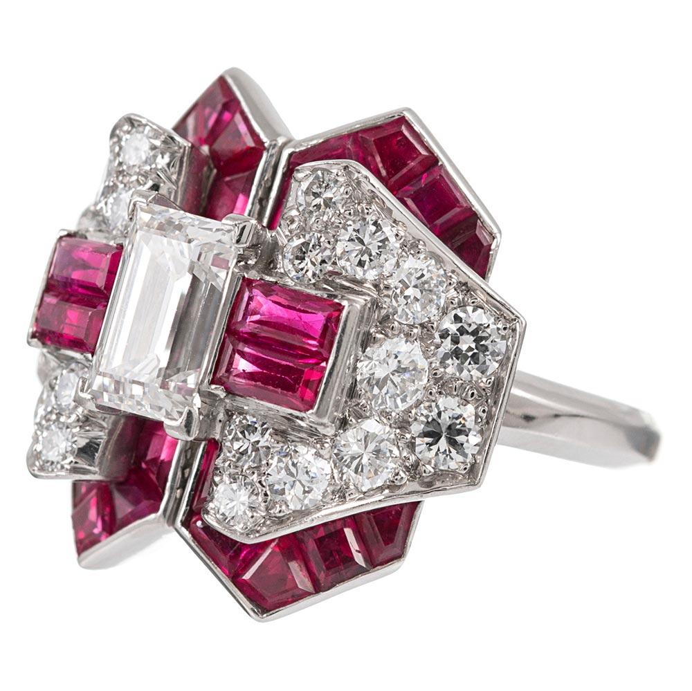 An outstanding example of mid-century finery, this retro ring boasts a striking design that is both magnificent and suitable for daily wear. Set in the center with a 1.05 carat emerald cut diamond that grades as F-G color with Vs1-2 clarity, the