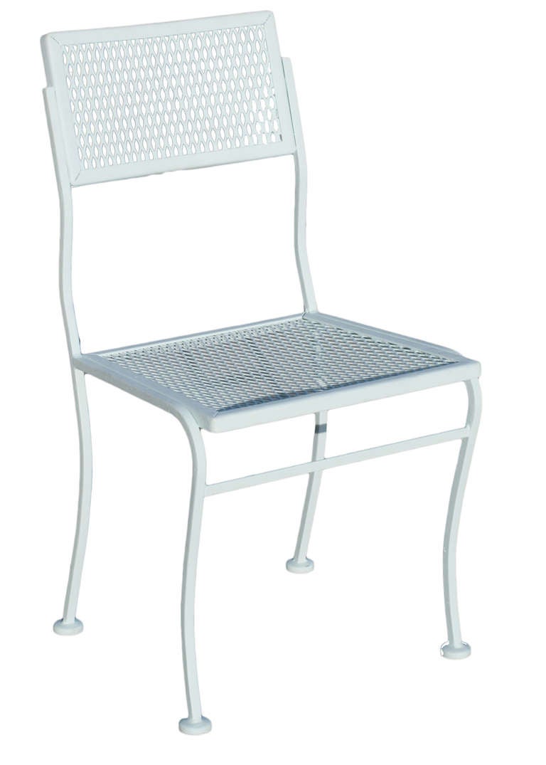 Outdoor steel mesh table and chairs set with one table and four chairs by the Woodard Company. The set has been repainted in flat teal; another color can be used upon request. Powder coating available upon request.

Measurements:
Table height