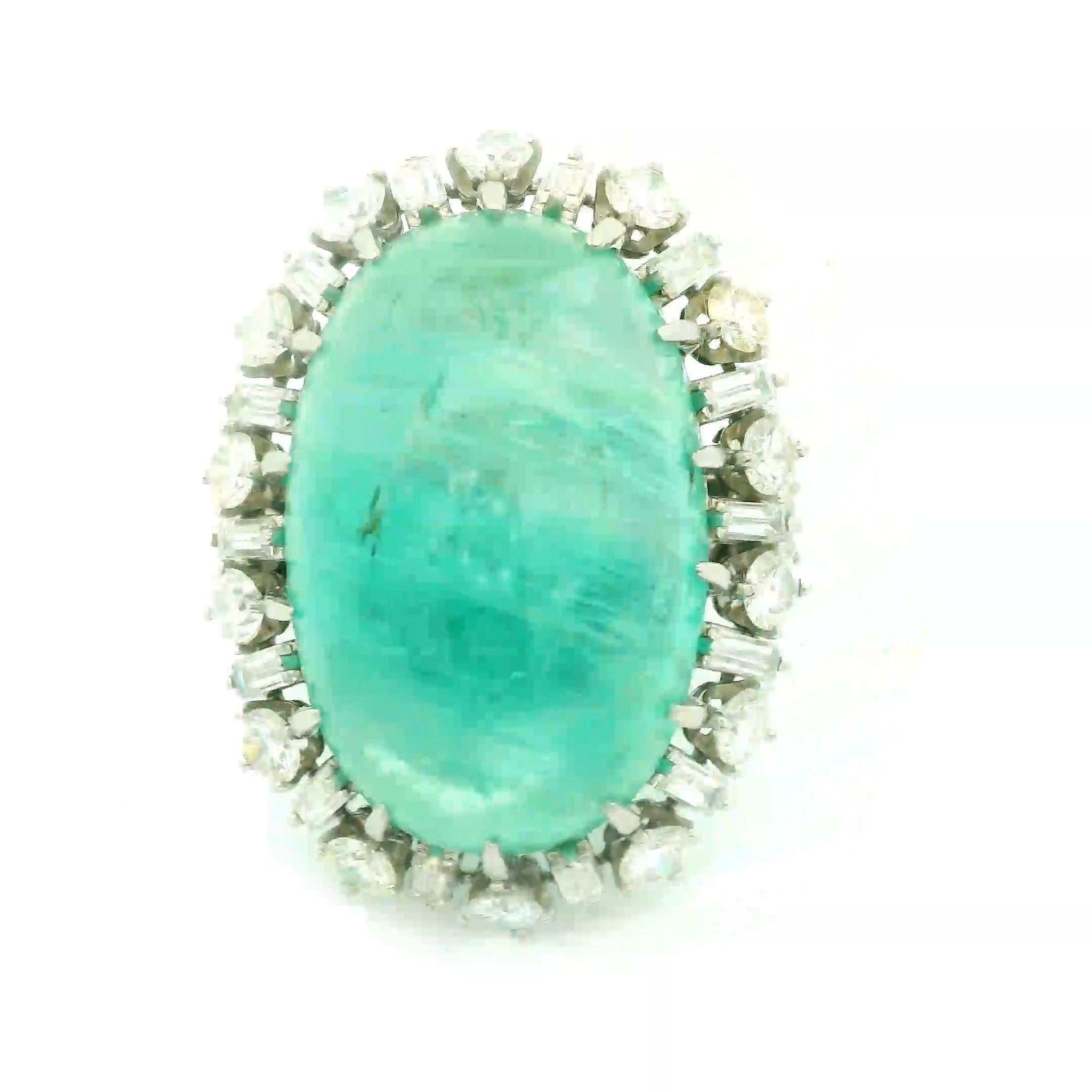 A unique and special ring featuring a large and impressive emerald weighing approximately 40 carats. The emerald is certified by the GIA as natural with a Russian origin, and it has a soft pleasing green color. It is complemented by round brilliant