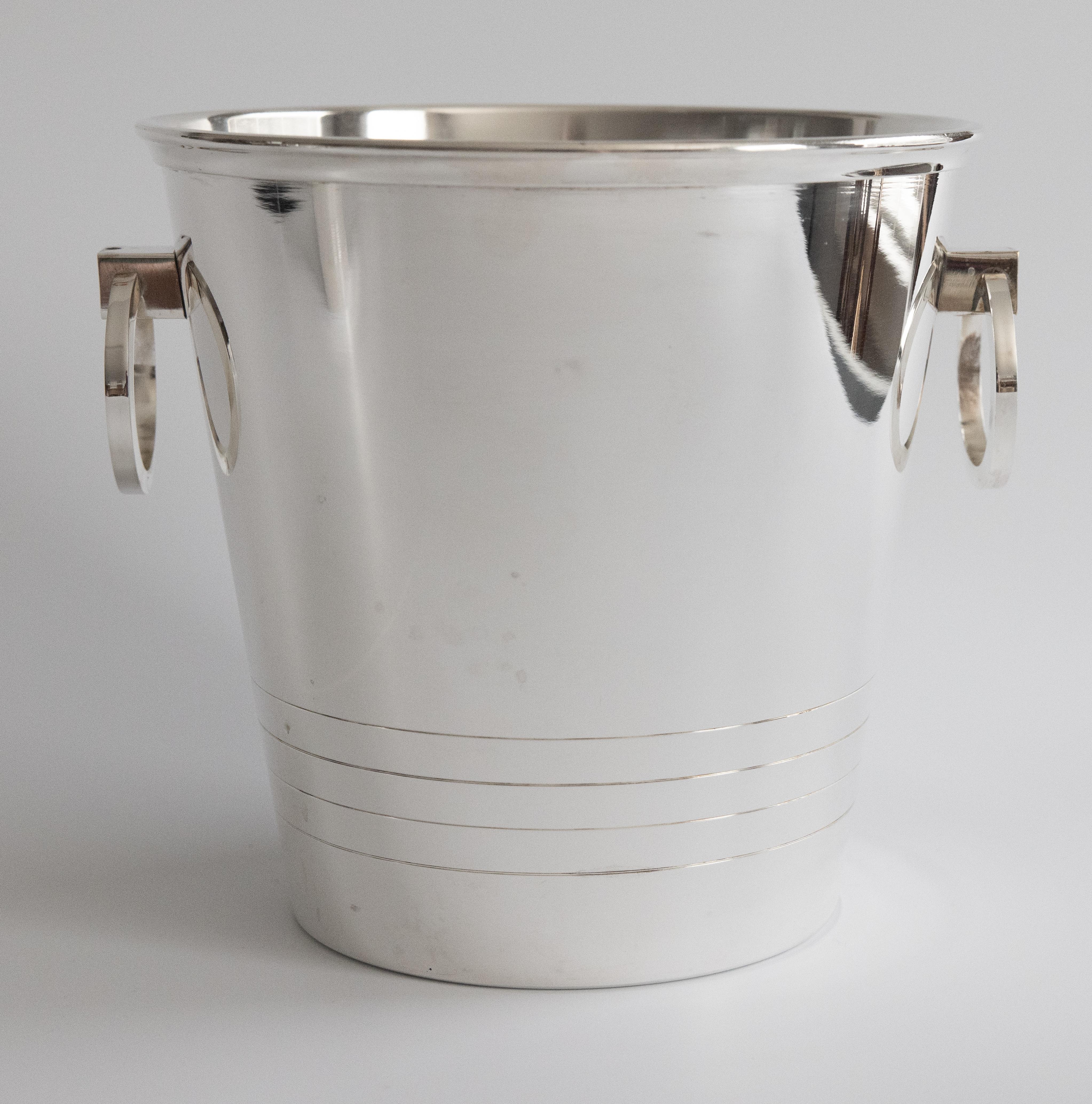 A marvelous matching set of Saint Medard French silverplated barware champagne bucket and ice buckets. This lovely set consists of a larger champagne cooler and a smaller ice bucket, each with ring handles. These fine quality ice buckets are solid