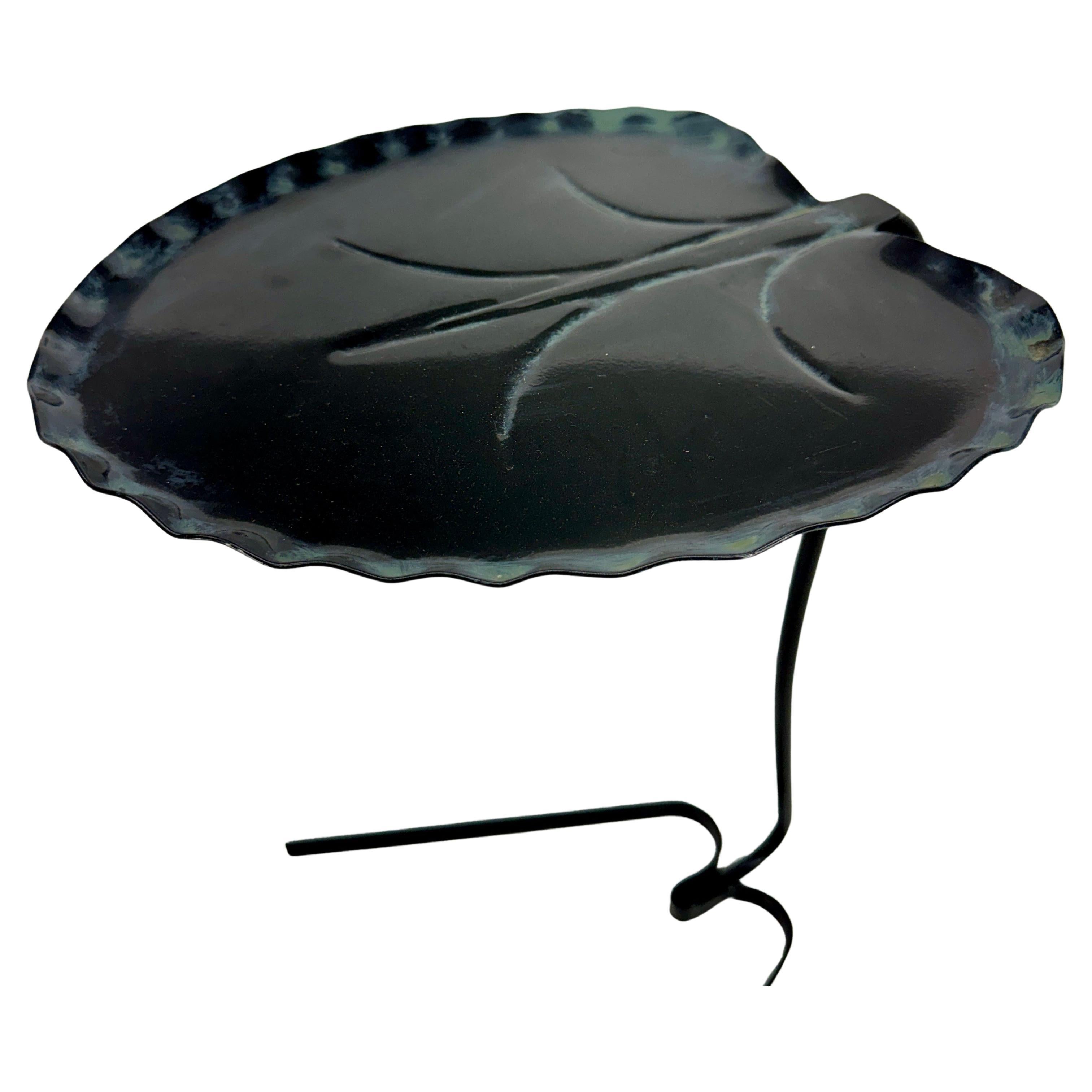 Salterini Lotus Leaf Table Garden Table, 1950's Italy

Salterini Leaf Table with original green patin. This classic wrought iron leaf table is in wonderful condition and certainly makes a statement anywhere placed indoor next to a favotite chair or