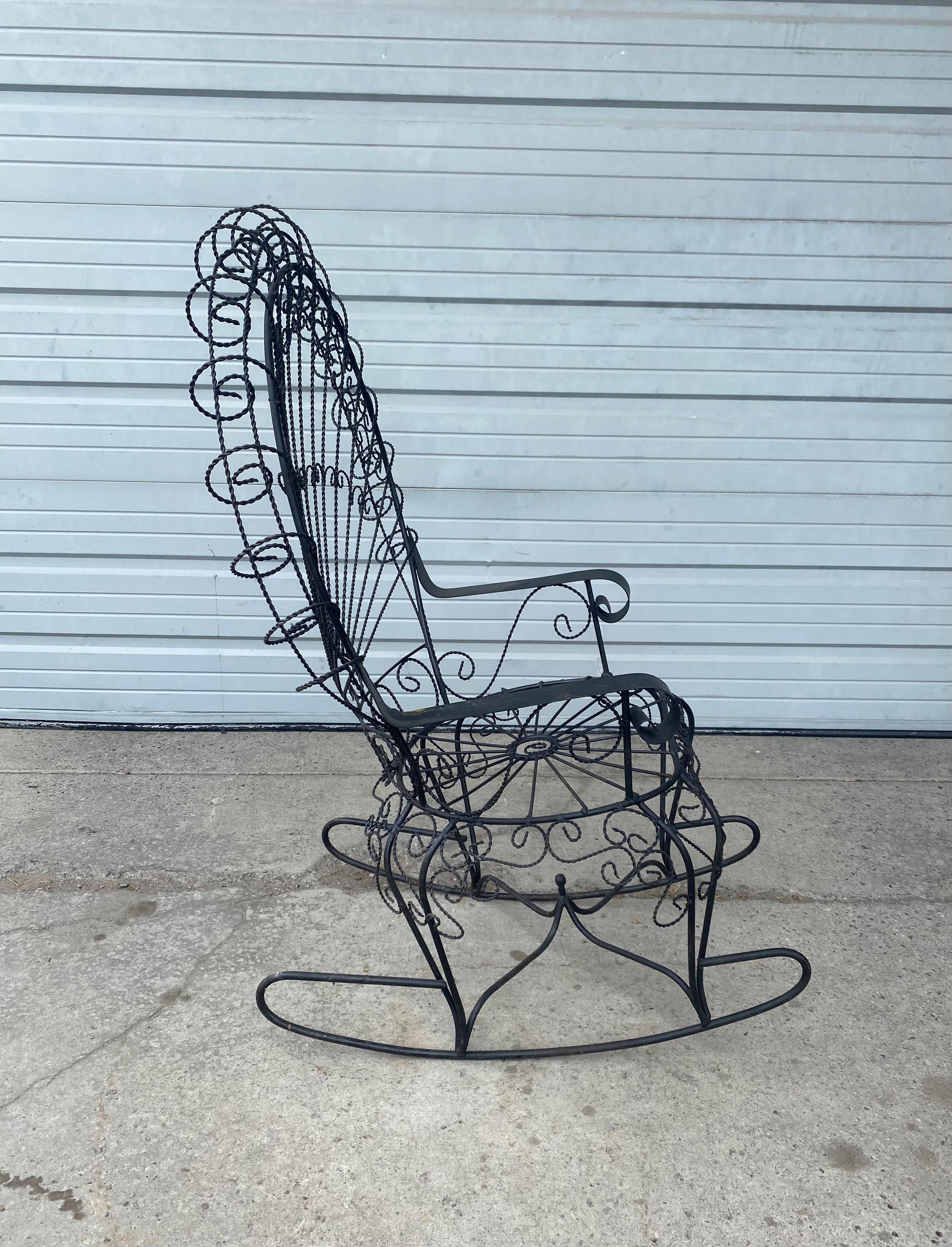Modernist wrought iron rocker, Designed by John Salterini. From the Peacock line. Stunning design, lesser seen rocker. Hand delivery avail to New York City or anywhere en route from Buffalo NY.
    