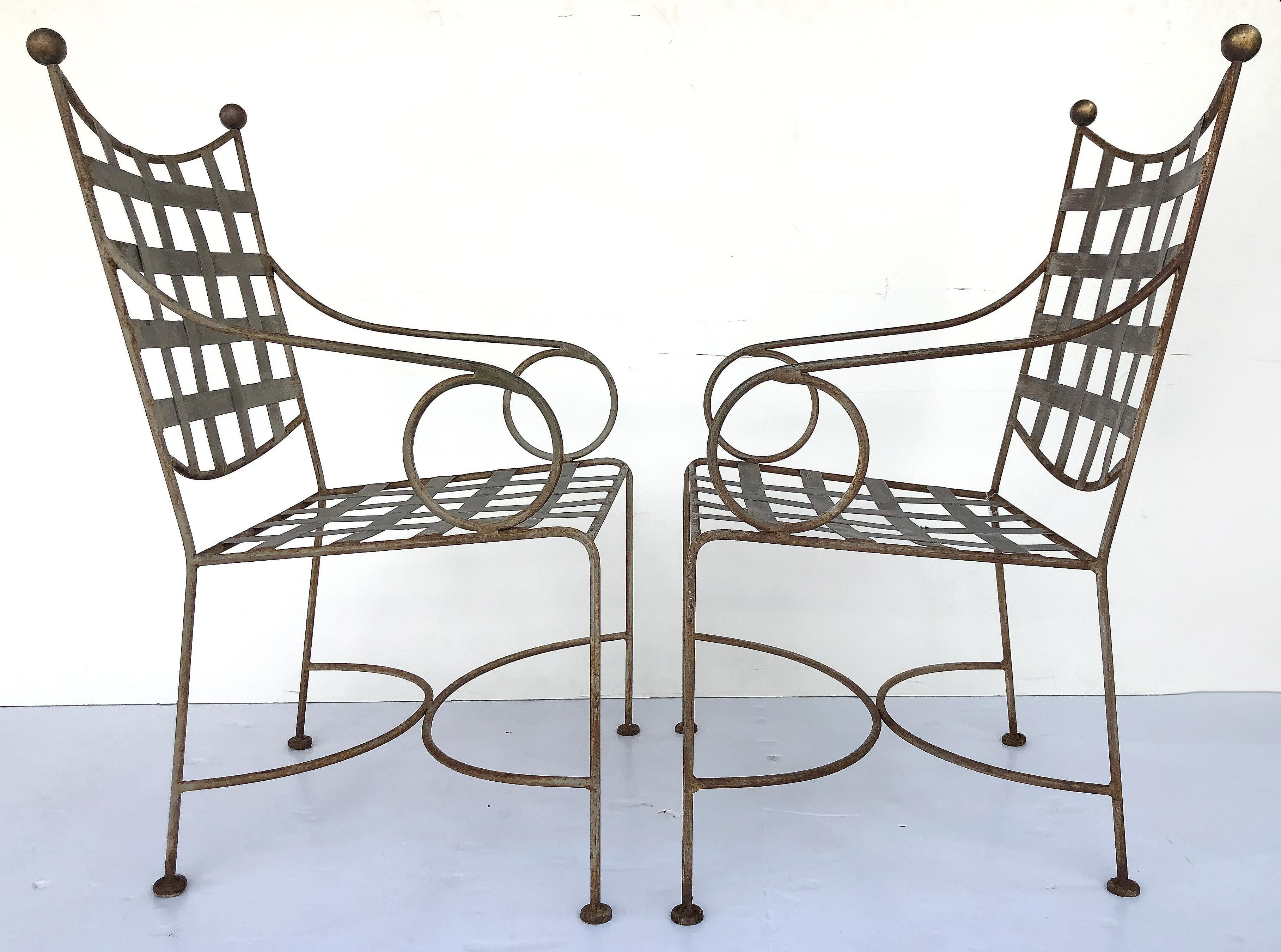 Midcentury Salterini wrought iron garden chairs, pair

Offered for sale is a vintage pair of Mid-Century Modern wrought iron garden chairs attributed to Salterini. The chairs have a sinuous classical design with a lovely rustic patina and brass