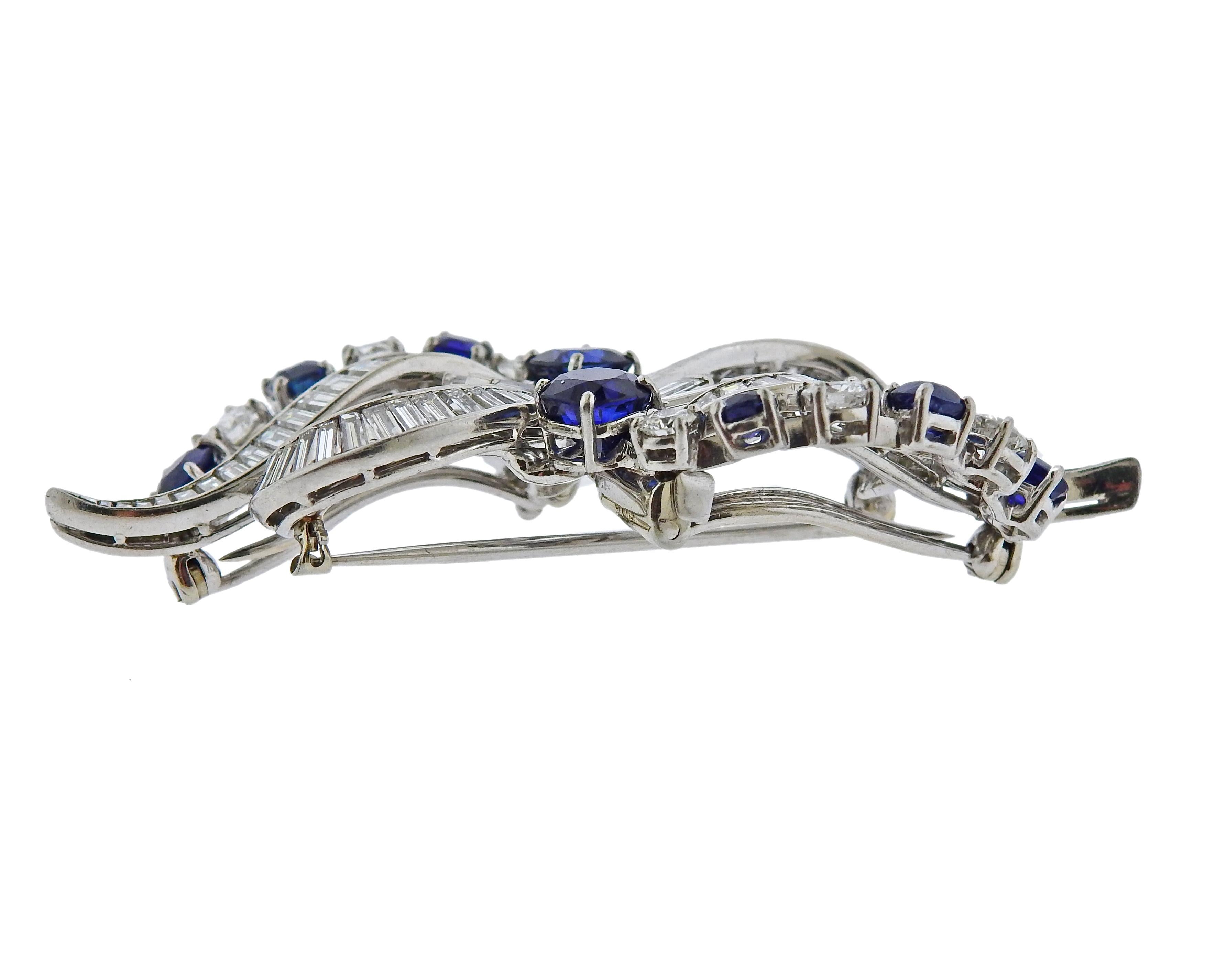 Vintage circa Mid Century platinum brooch, converts into two clips. Set with approx. 3.00ctw in baguette and round cut diamonds, as well as approx. 3.65ctw in blue sapphires. Brooch is 62mm x 25mm. Marked 805 .  Weighs 22.3 grams.

SKU#PB-02687
