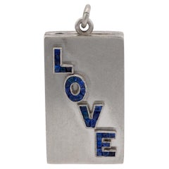 Mid Century sapphire platinum "Love" locket
