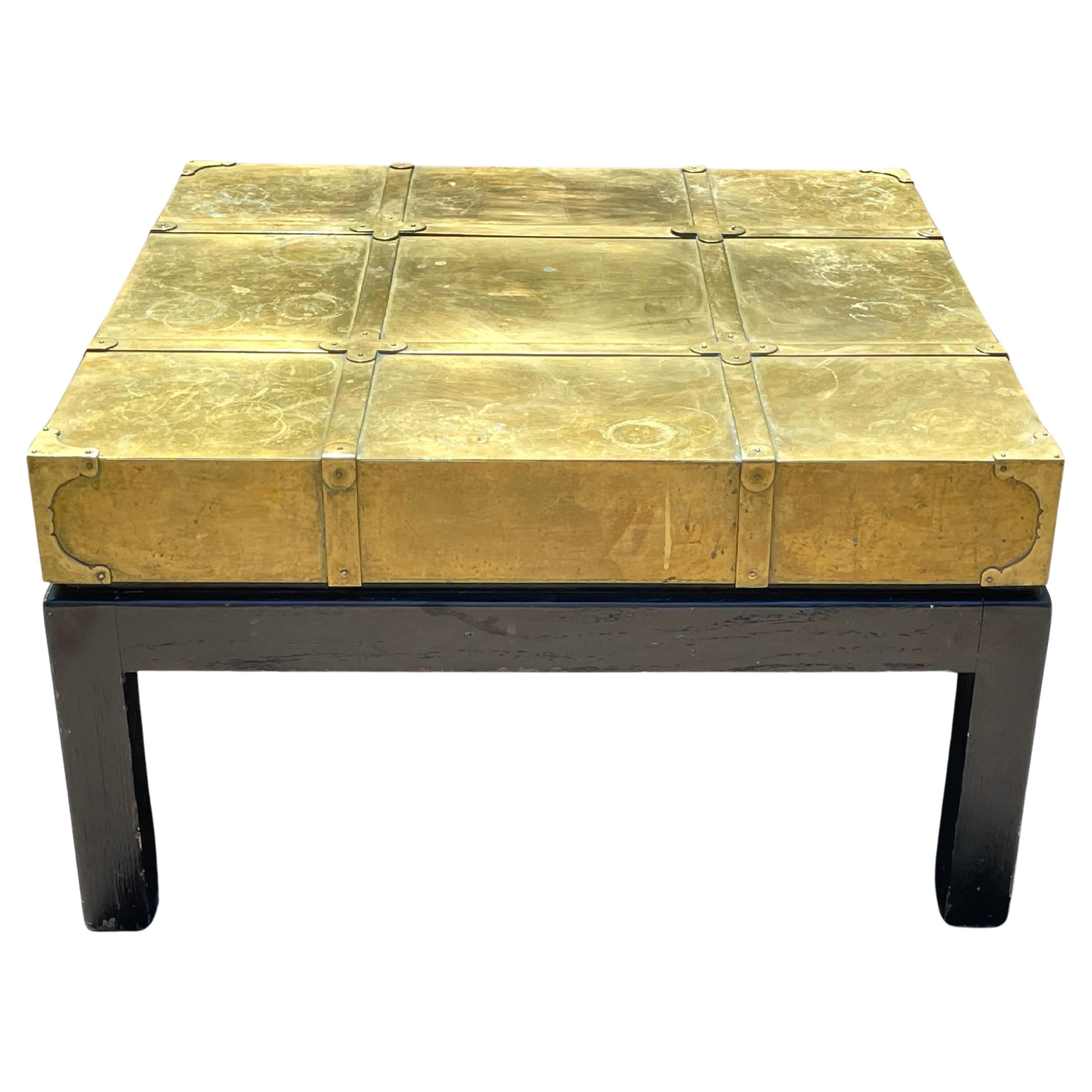 A gorgeous original 1970s patinated brass & walnut coffee / cocktail table designed by Sarreid of Spain.

Good vintage condition. Nice golden patina on brass. Multiple scuffs and marks on top and walnut base. See photos.

Width: 30.5 in.
Depth: 30.5