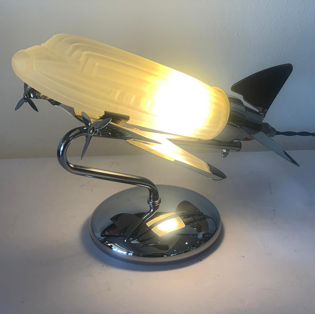 A 1970s Lamp by the Sarsparilla Co. of NY as a plane in chrome and glass. Believed to be based on the DC-3 Aeroplane designed in 1933 which was one of the main features of the New York World’s Fair in 1939, as it was the main carrier of passengers