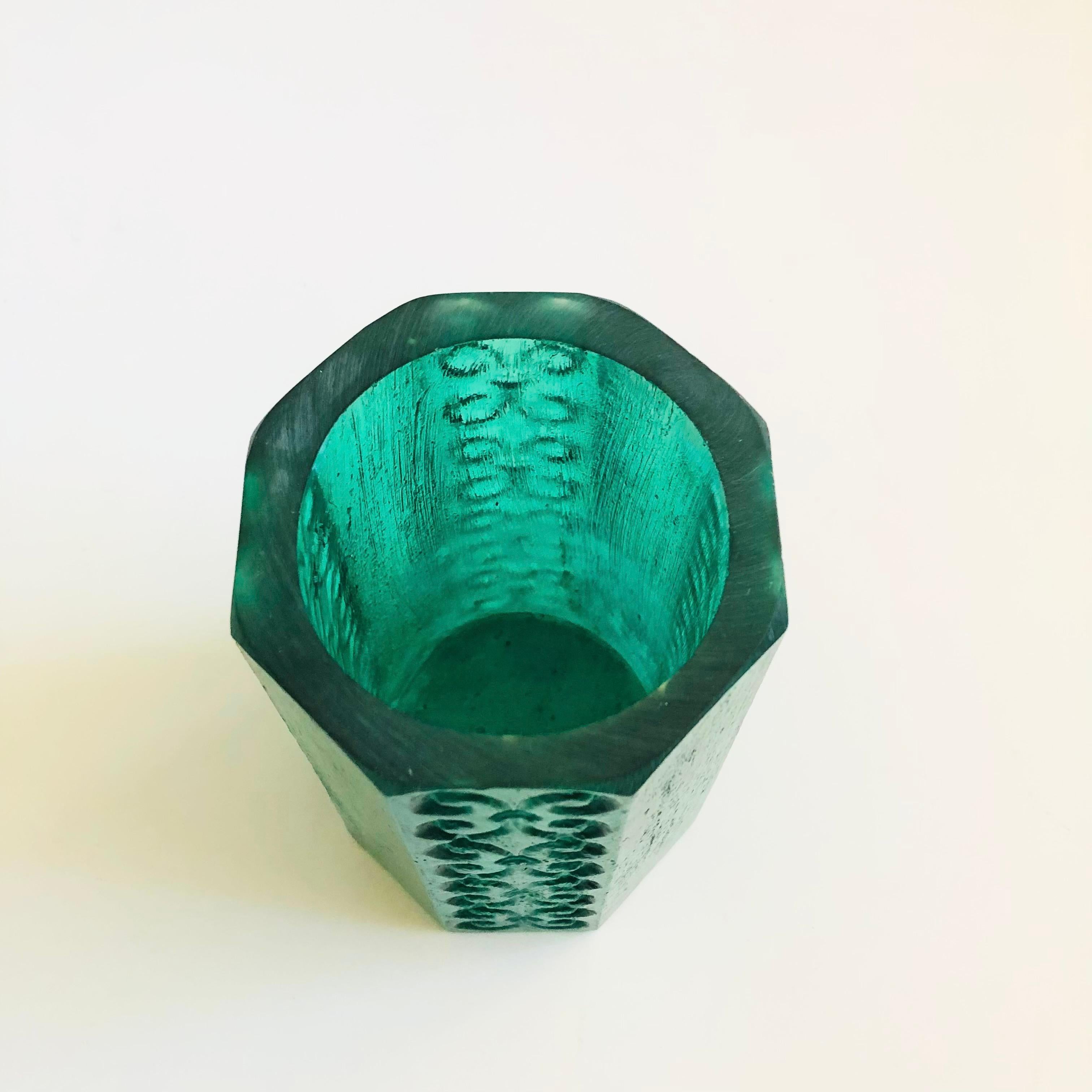 A mid century vessel to use as a candle holder or vase. Made by Sascha Brastoff out of teal textured resin. Signed on the base.


