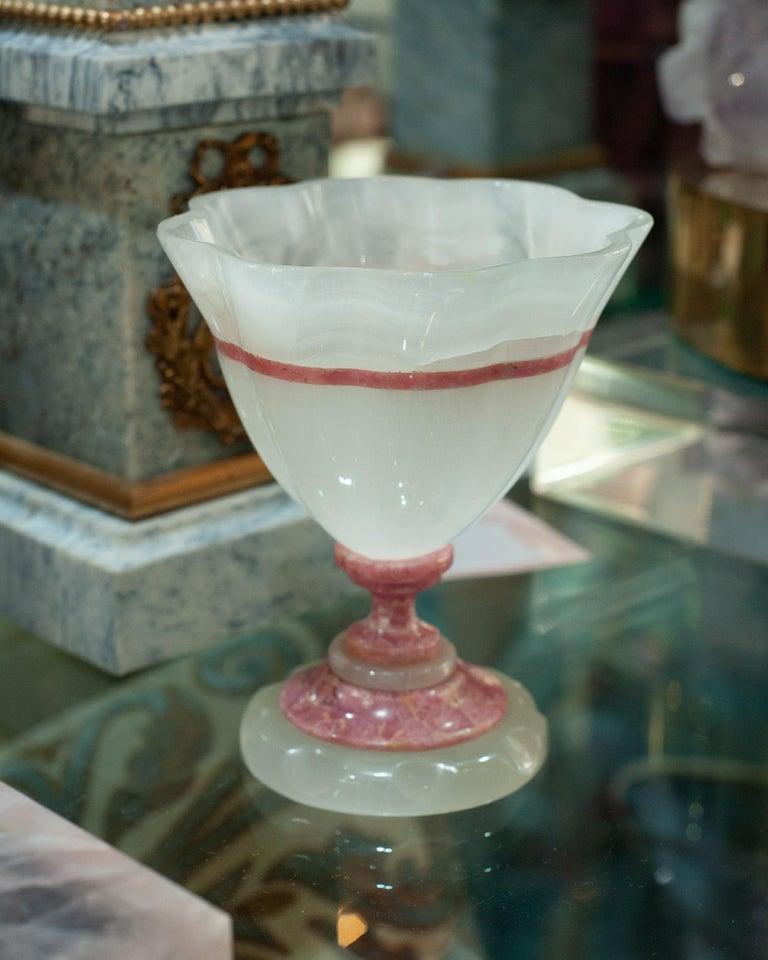 A stunning mid-century scalloped white onyx and rhodonite bowl with footed pedestal base. Finely carved with delicate scalloped shape, in an exceptional quality of stone.