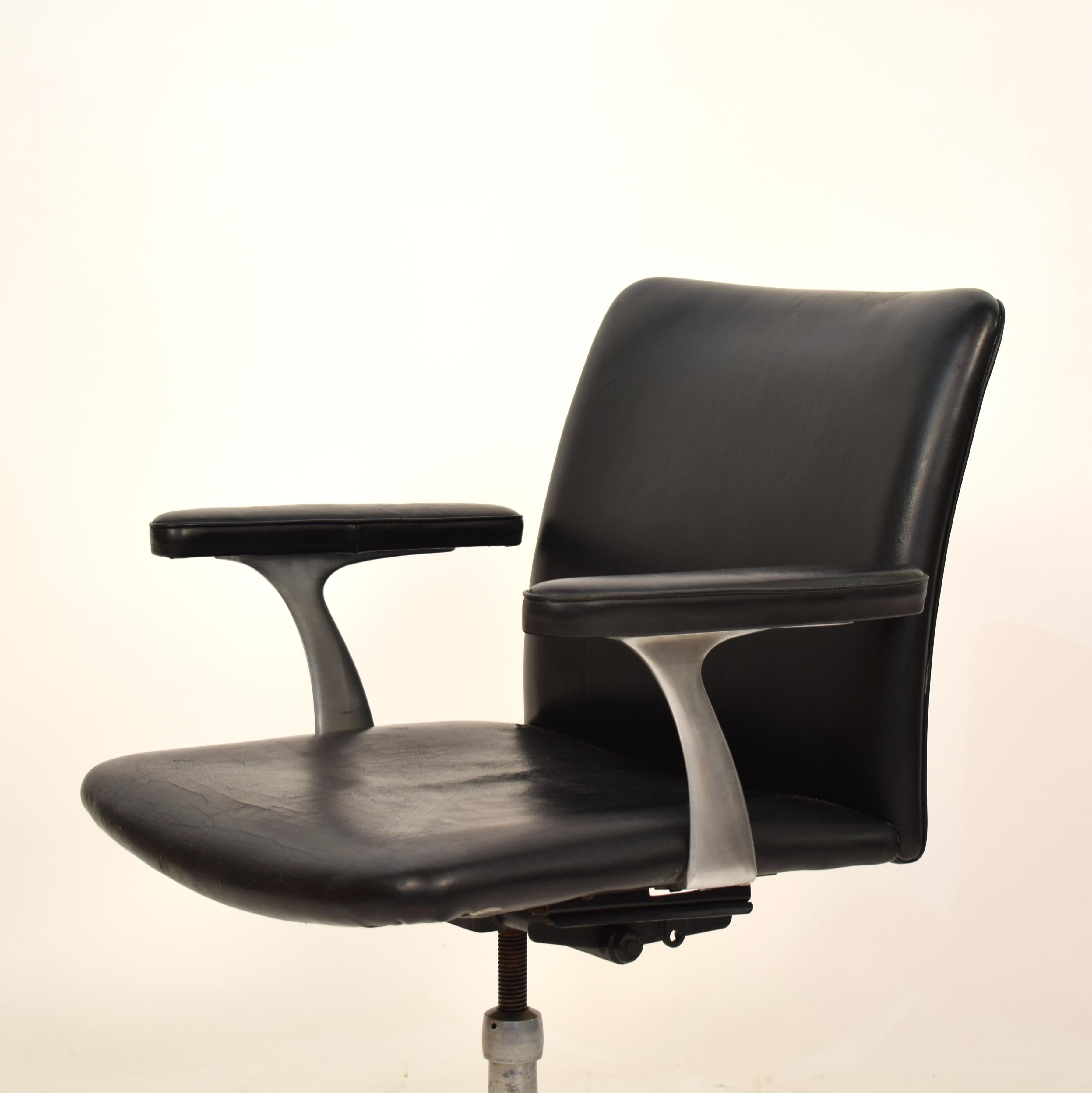 This midcentury Scandinavian armchair in black leather and aluminum was made circa 1970 in Denmark. It is tiltable. 
It is in good vintage condition with some wear on the leather but no cuts.
There are four of them available.

A unique piece